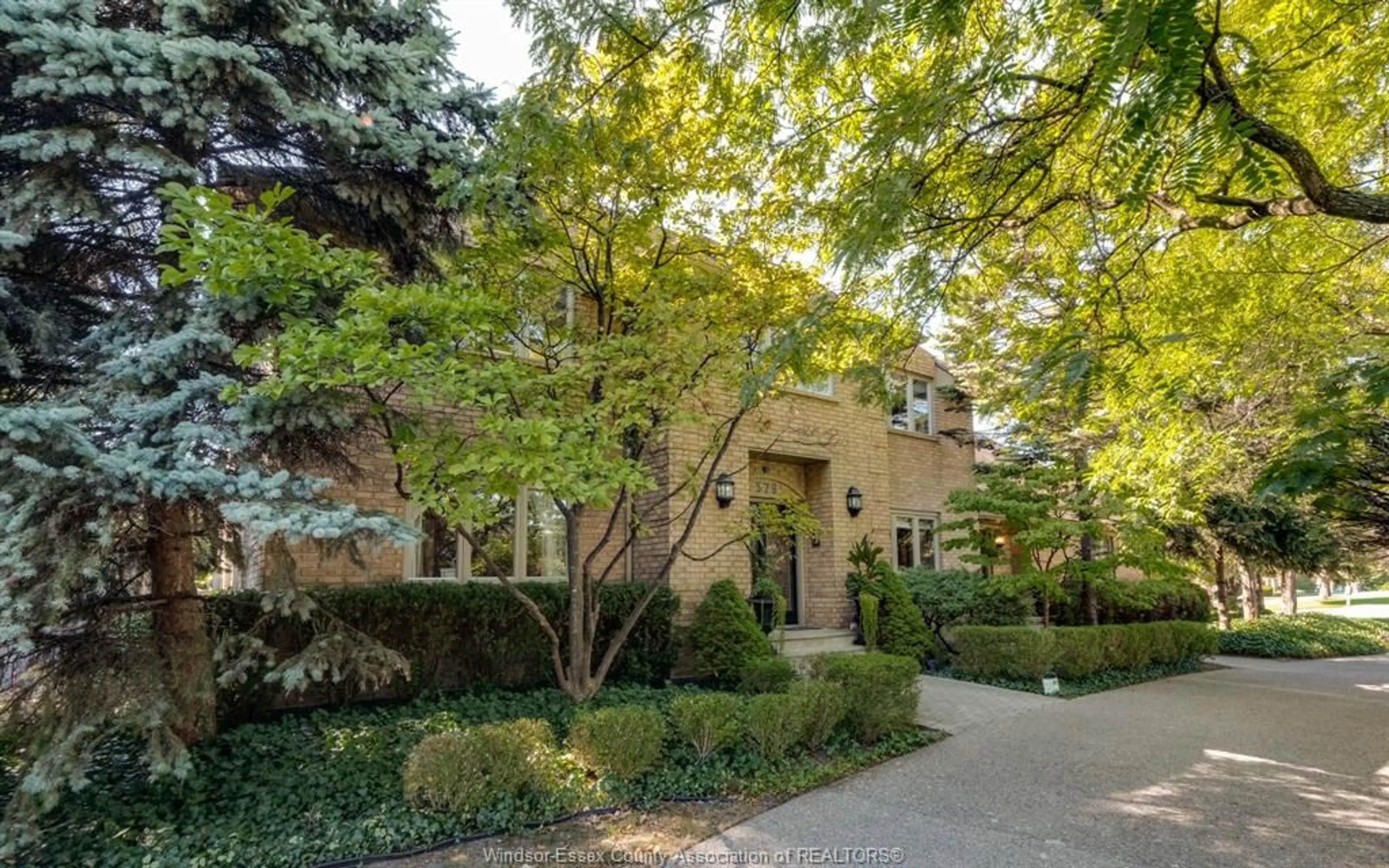 Home with brick exterior material, street for 379 ELMGROVE Dr, Lakeshore Ontario N8N 4H2