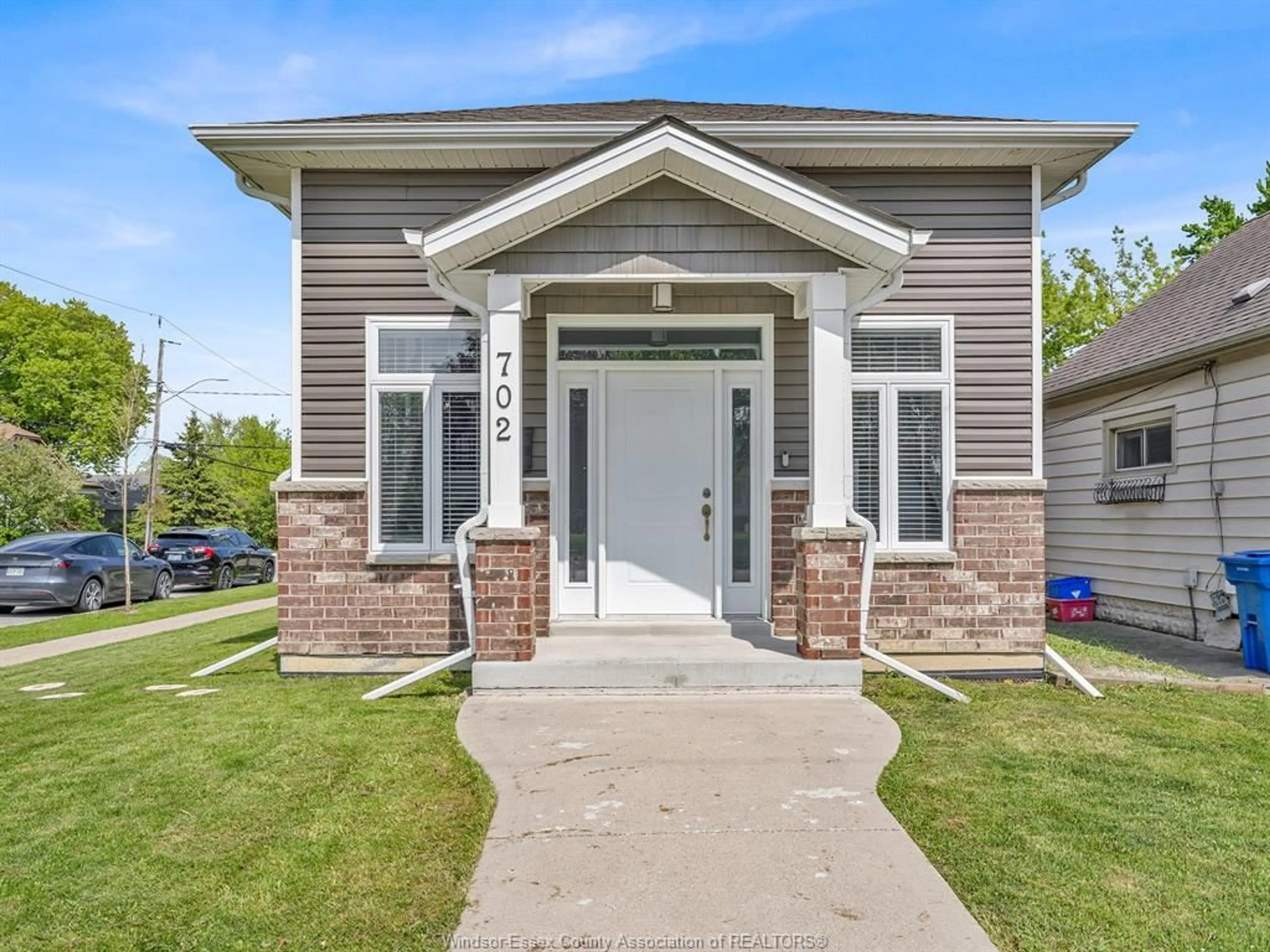 Home with vinyl exterior material, street for 702 LESPERANCE Rd, Tecumseh Ontario N8N 1W7