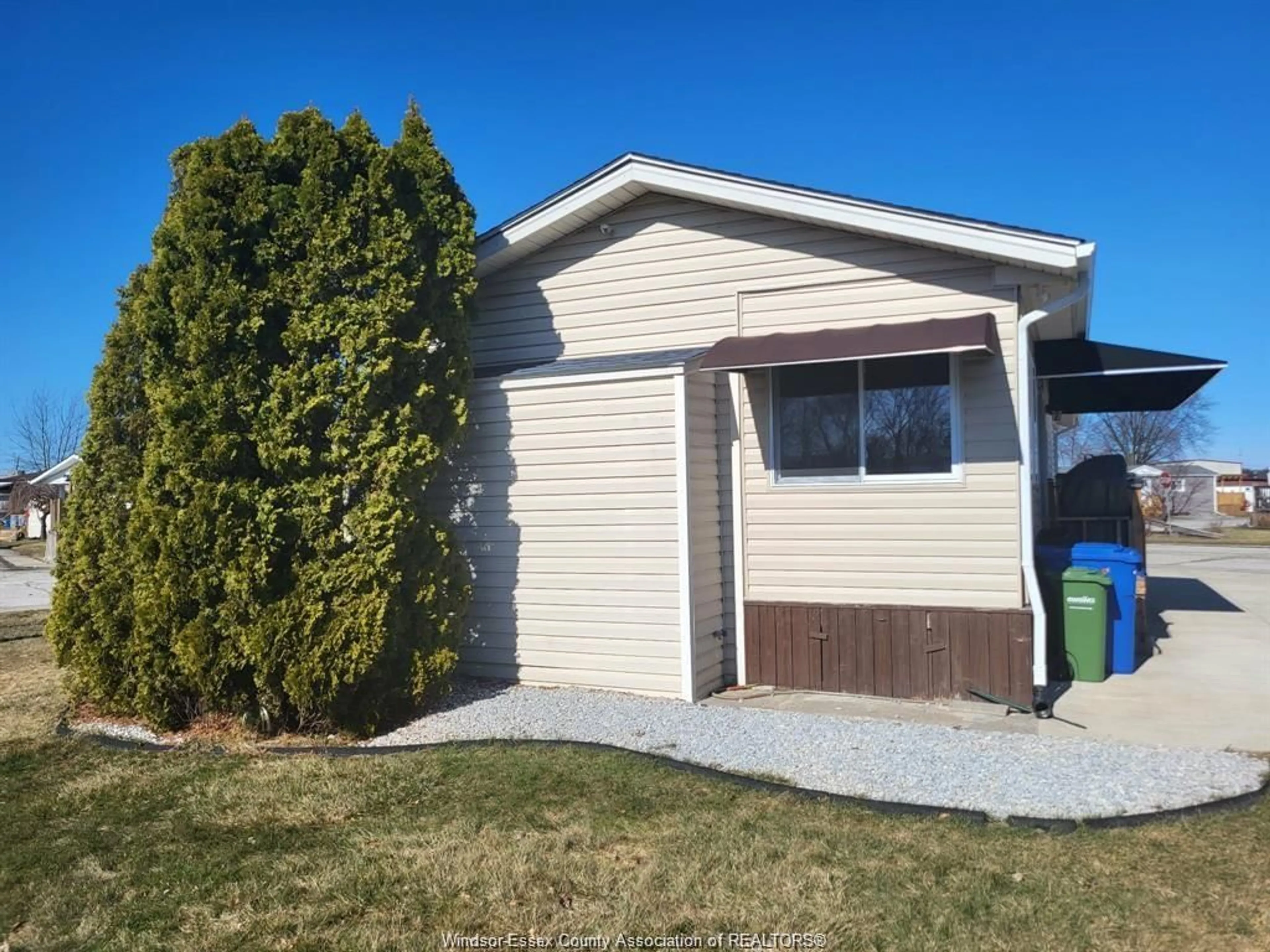 Home with vinyl exterior material, street for 1 WILDER #MOBILE HOME ONLY, Lakeshore Ontario N8N 2S9