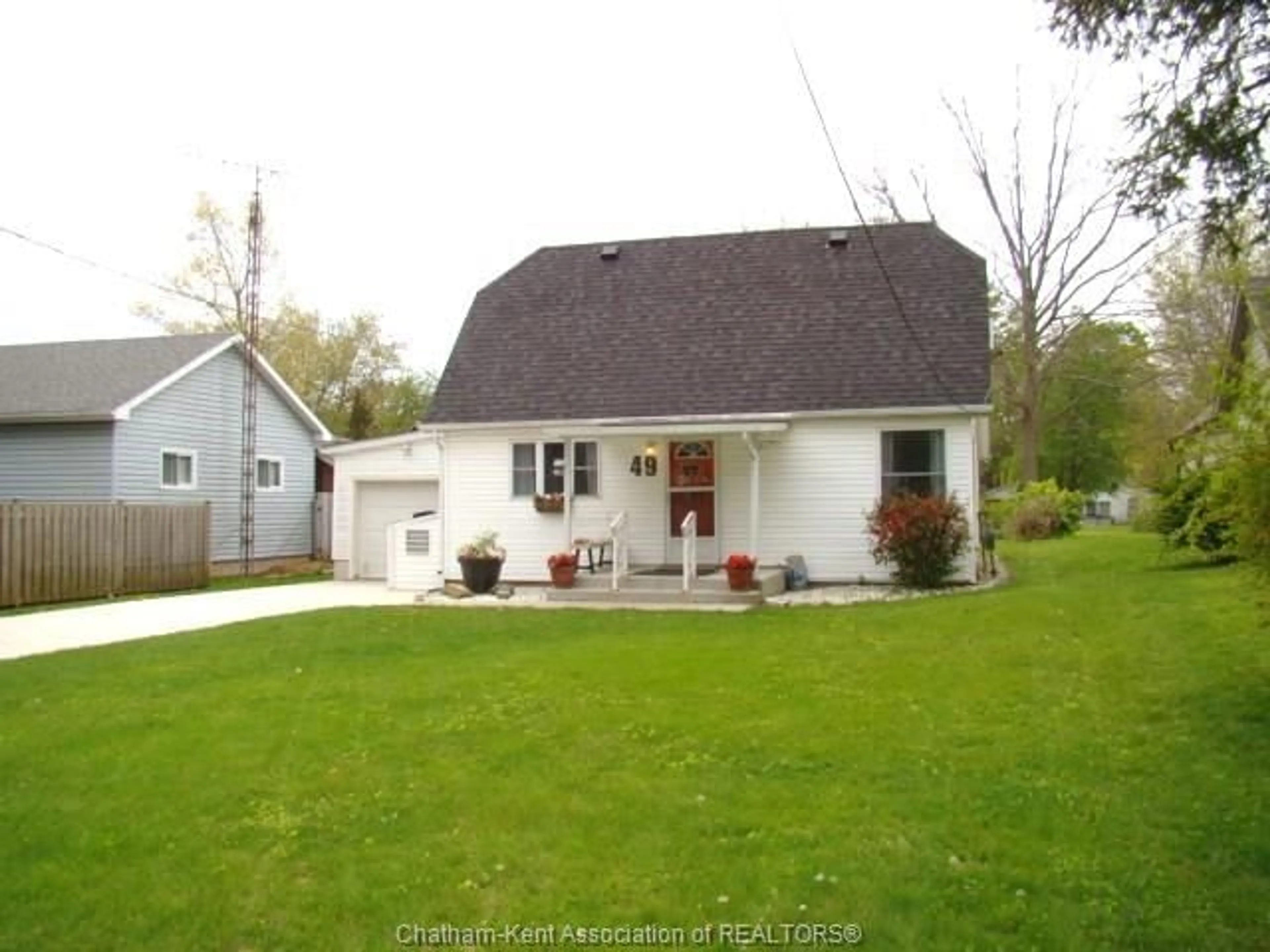 Home with vinyl exterior material, street for 49 BROADWAY St, Ridgetown Ontario N0P 2C0