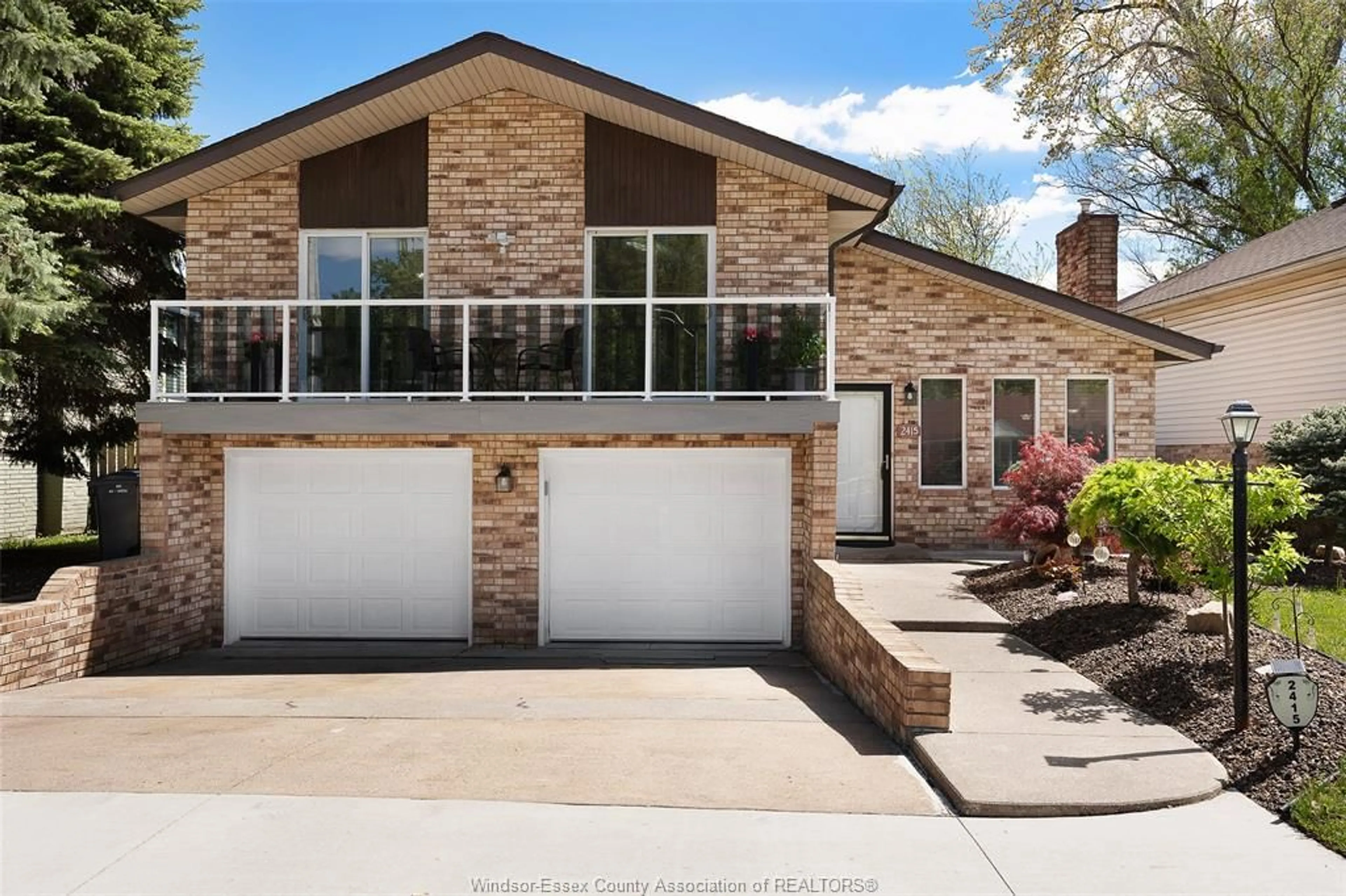 Home with brick exterior material, street for 2415 CABANA Rd, Windsor Ontario N9G 1E2