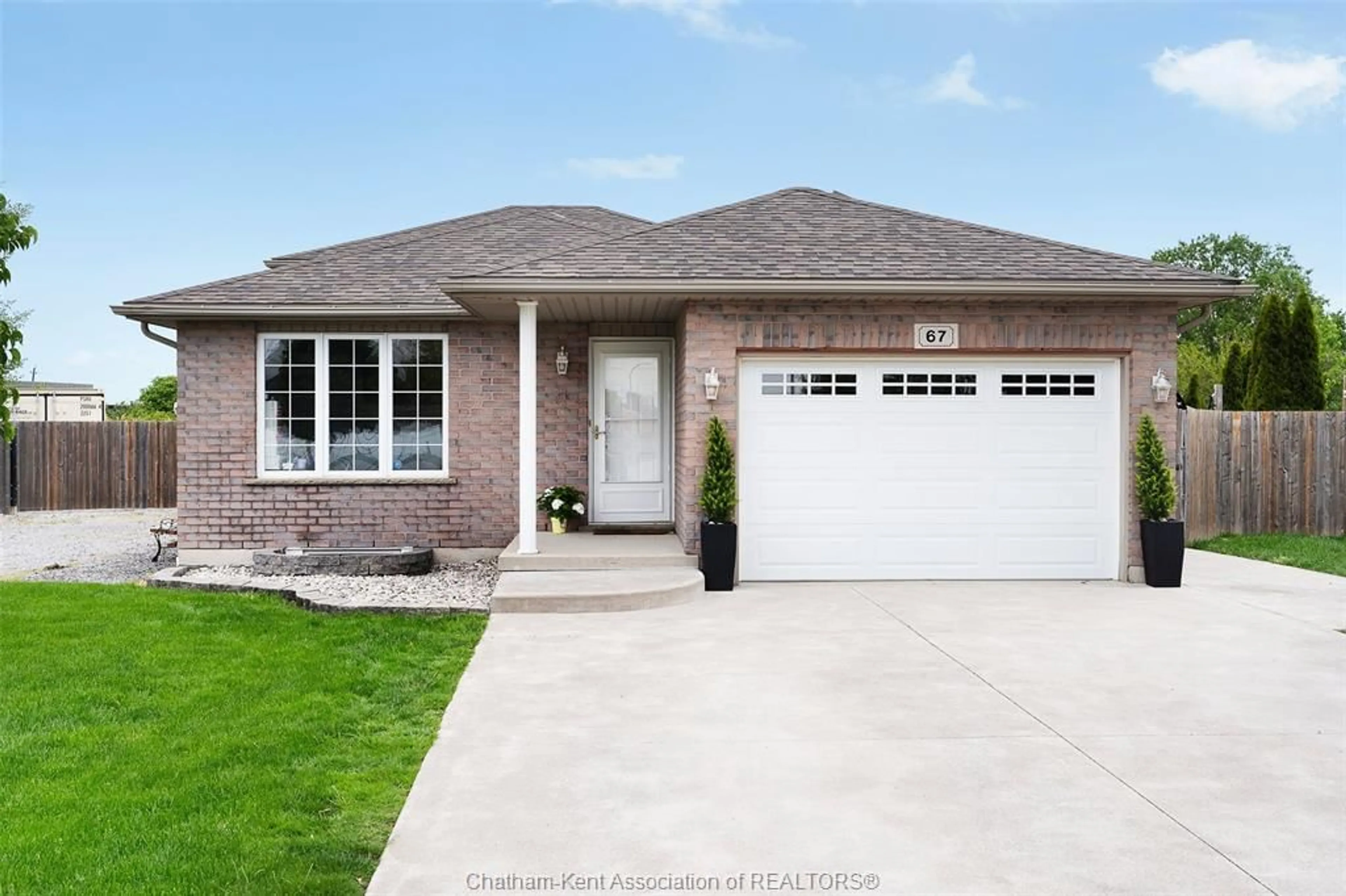 Home with brick exterior material, street for 67 Azar Ave, Tilbury Ontario N0P 2L0