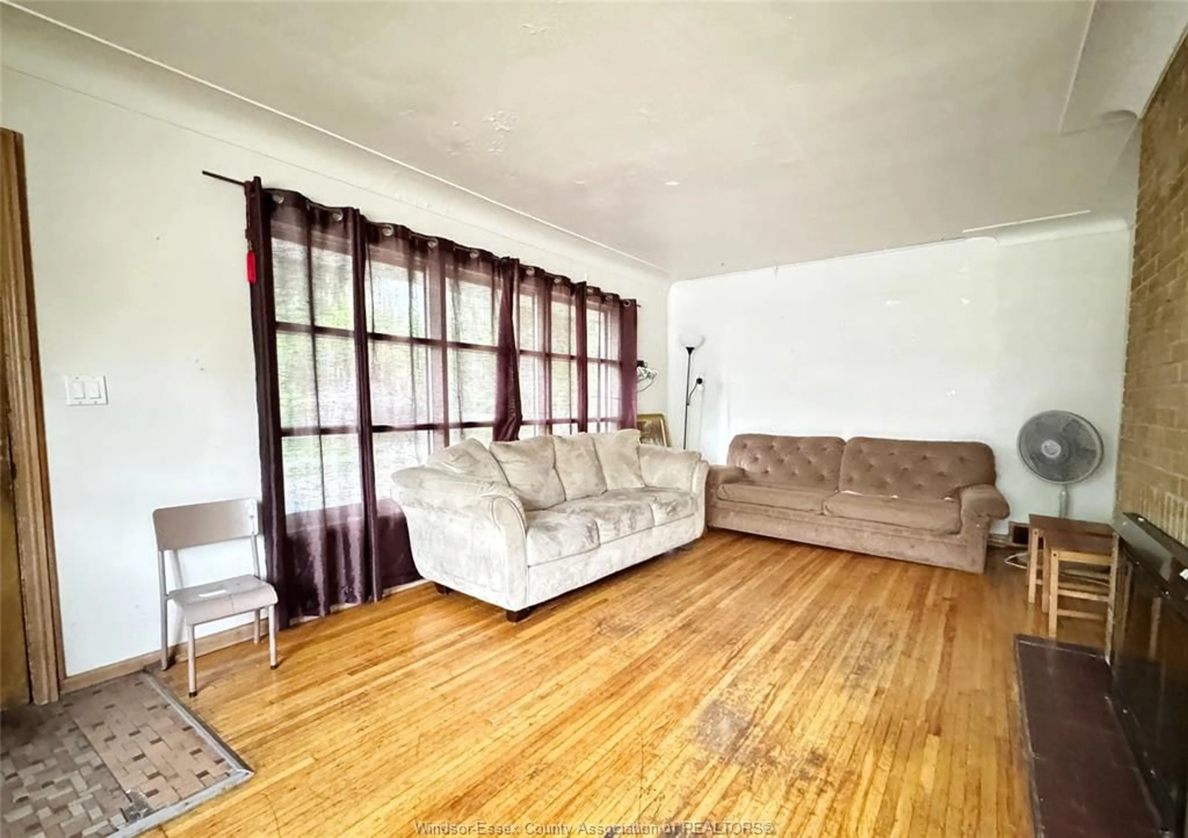 Living room with furniture, wood/laminate floor for 3006 Alexander Ave, Windsor Ontario N9C 1G5