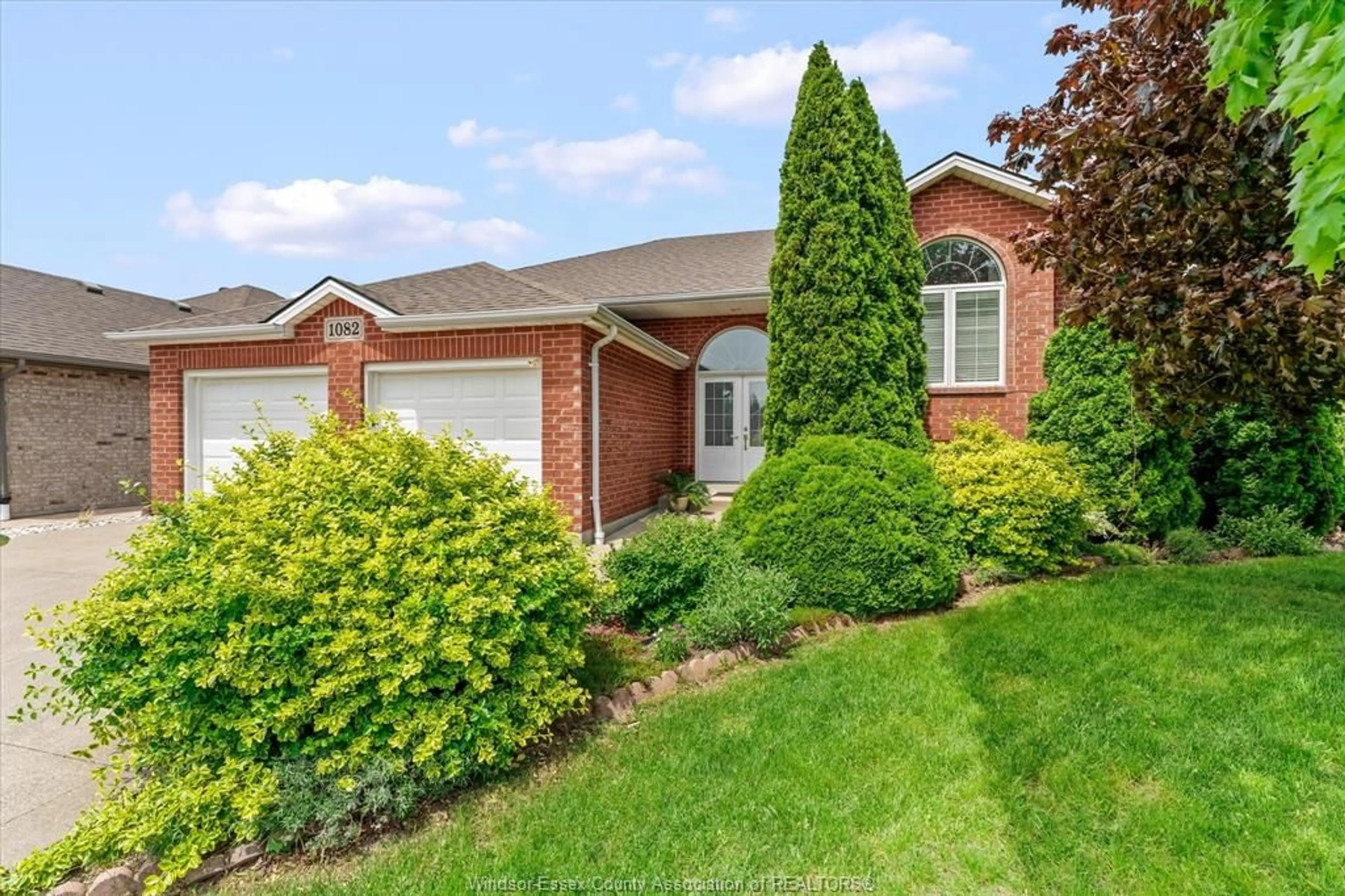 Home with brick exterior material, street for 1082 MONARCH MEADOWS, Lakeshore Ontario N0R 1A0