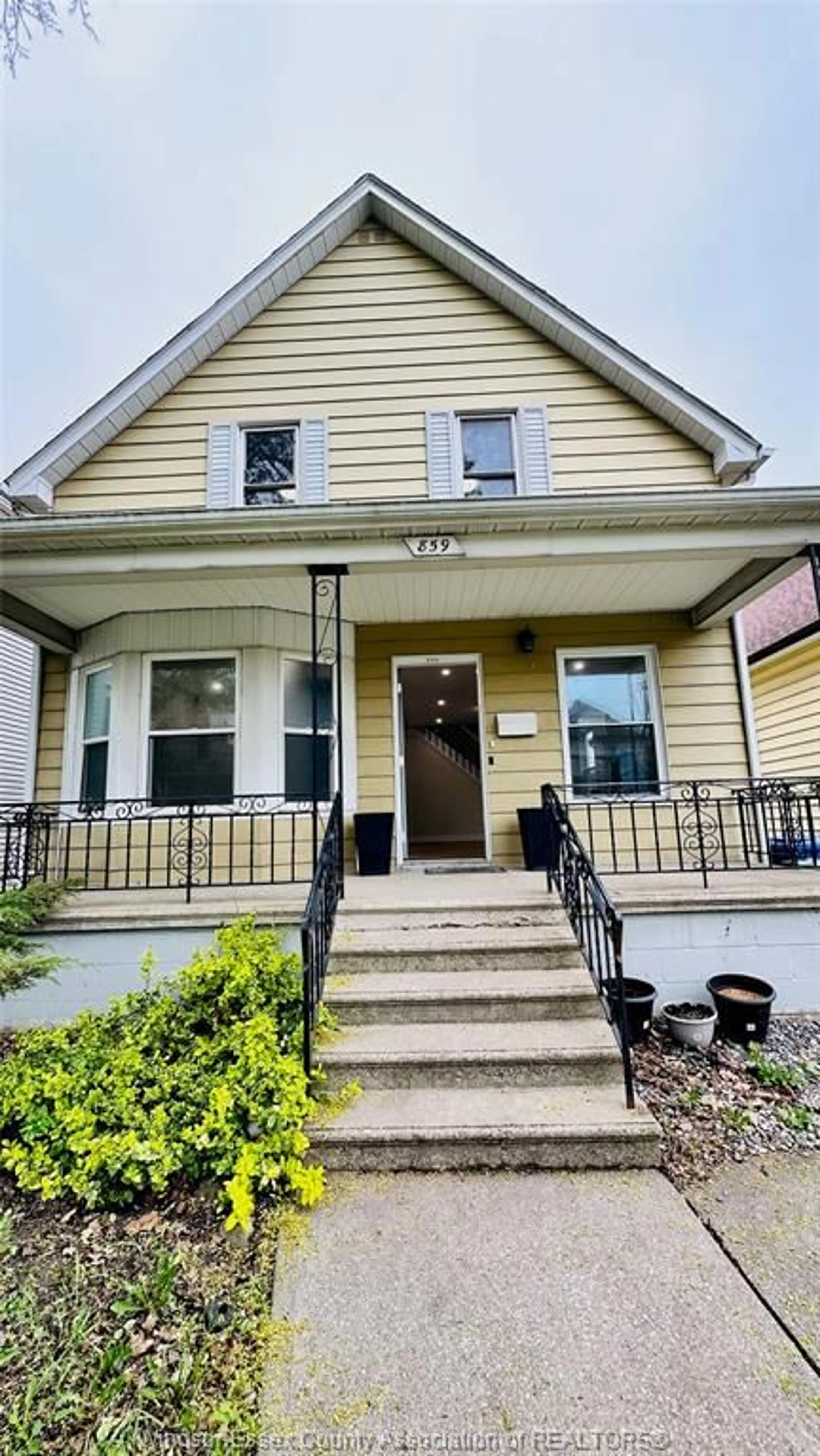 Home with vinyl exterior material, street for 859 PIERRE Ave, Windsor Ontario N9A 2K9