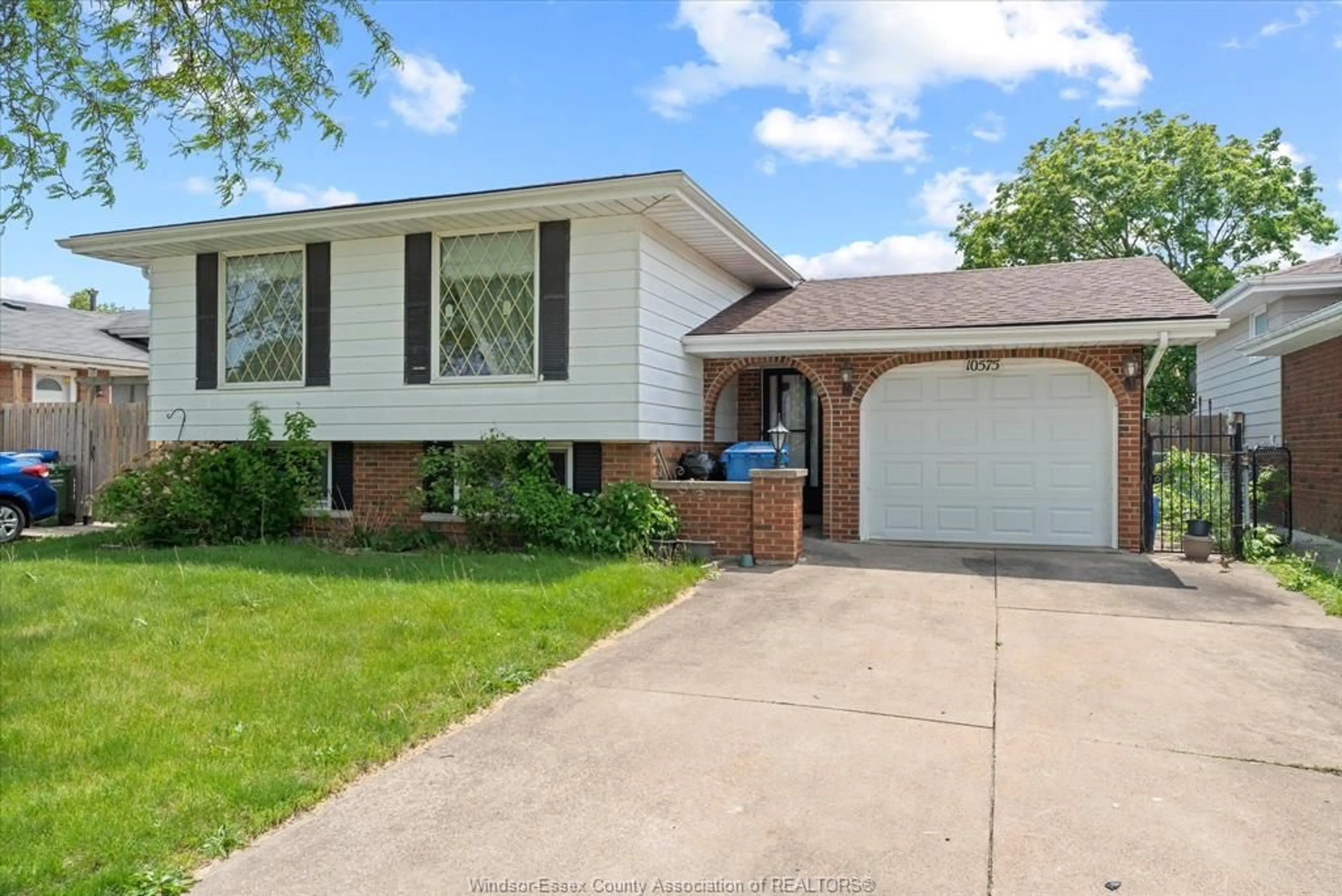 Home with brick exterior material, street for 10575 Mulberry Dr, Windsor Ontario N8R 1H7