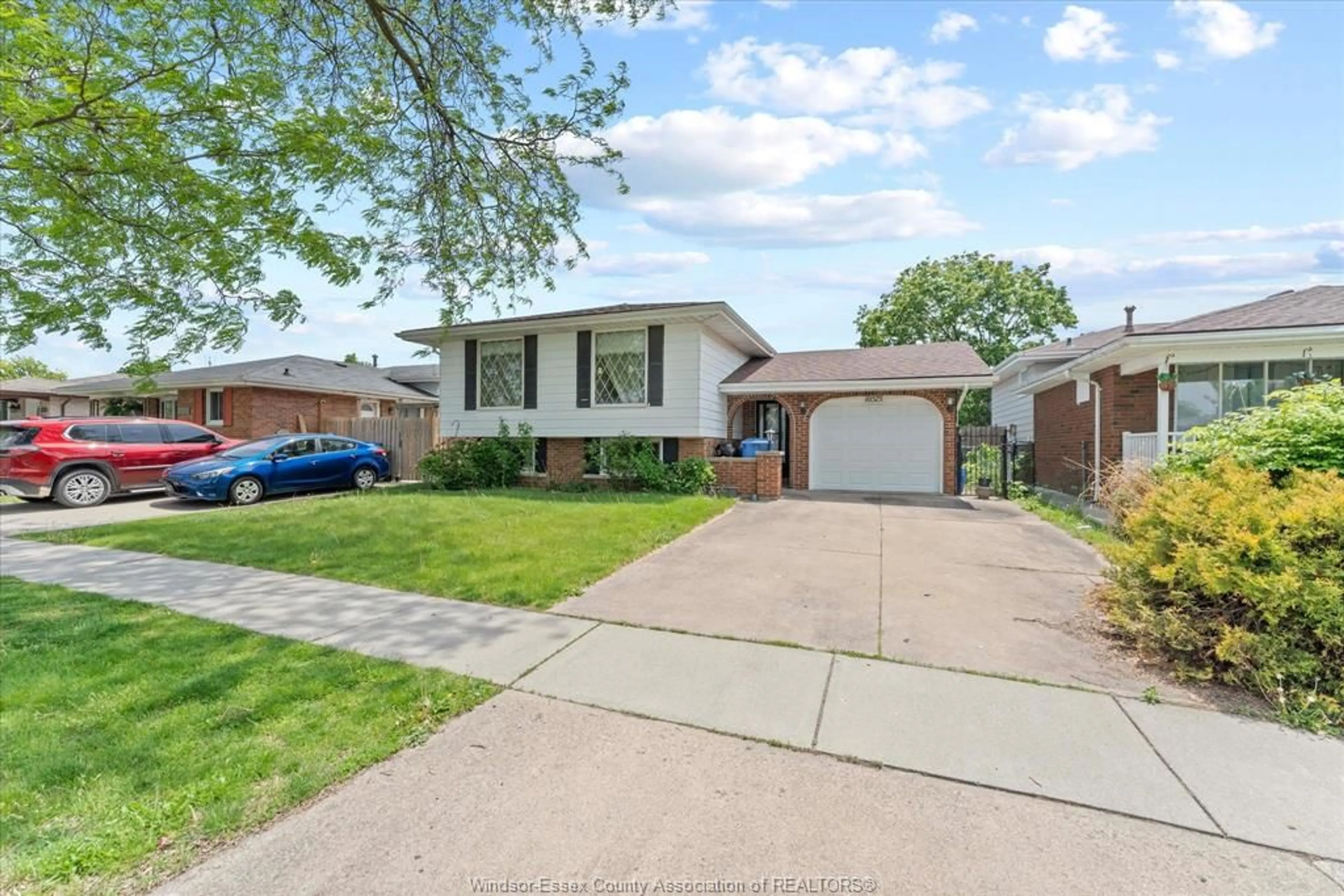 Home with brick exterior material, street for 10575 Mulberry Dr, Windsor Ontario N8R 1H7