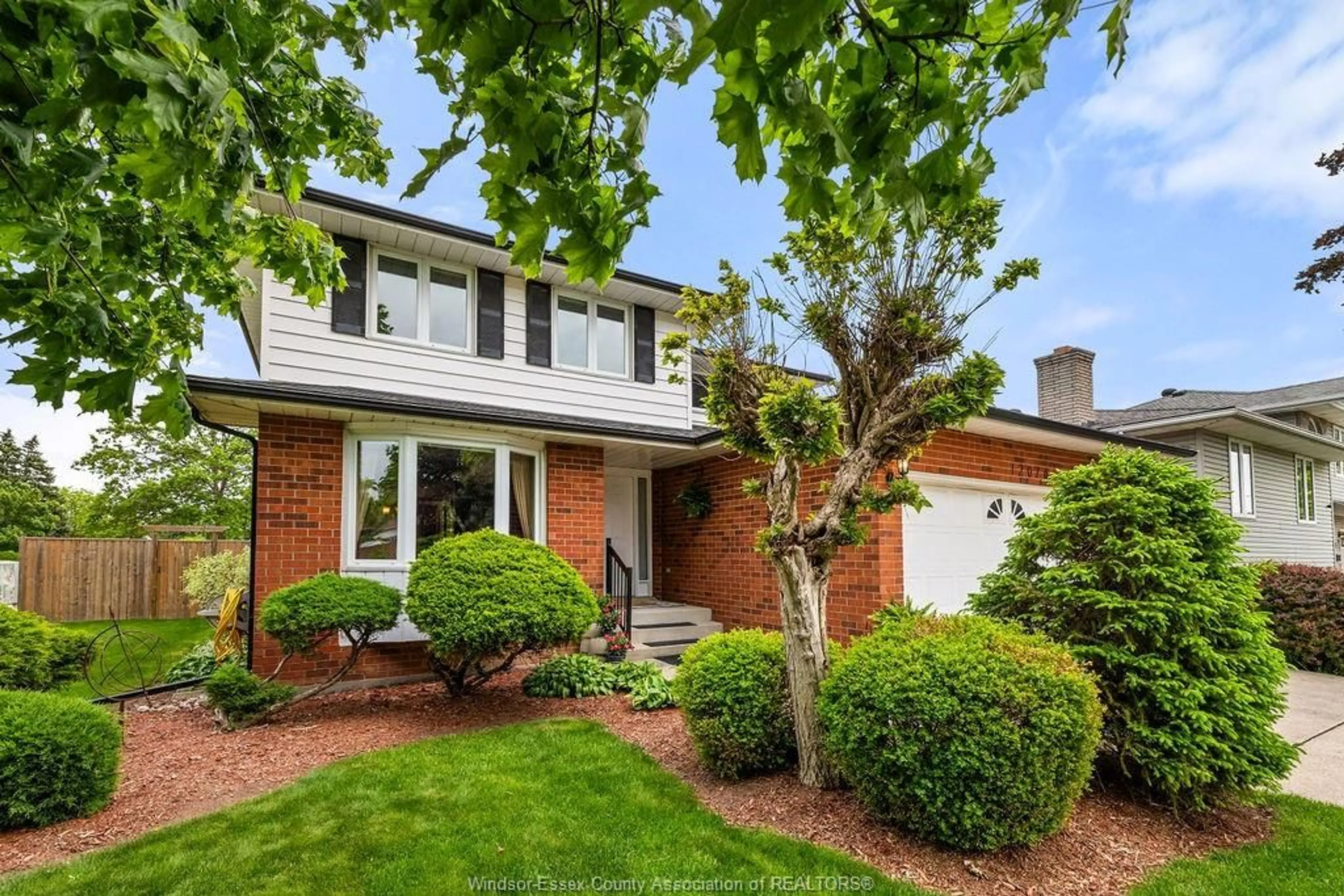 Home with brick exterior material, street for 12076 ST. THOMAS Cres, Tecumseh Ontario N8N 3V7