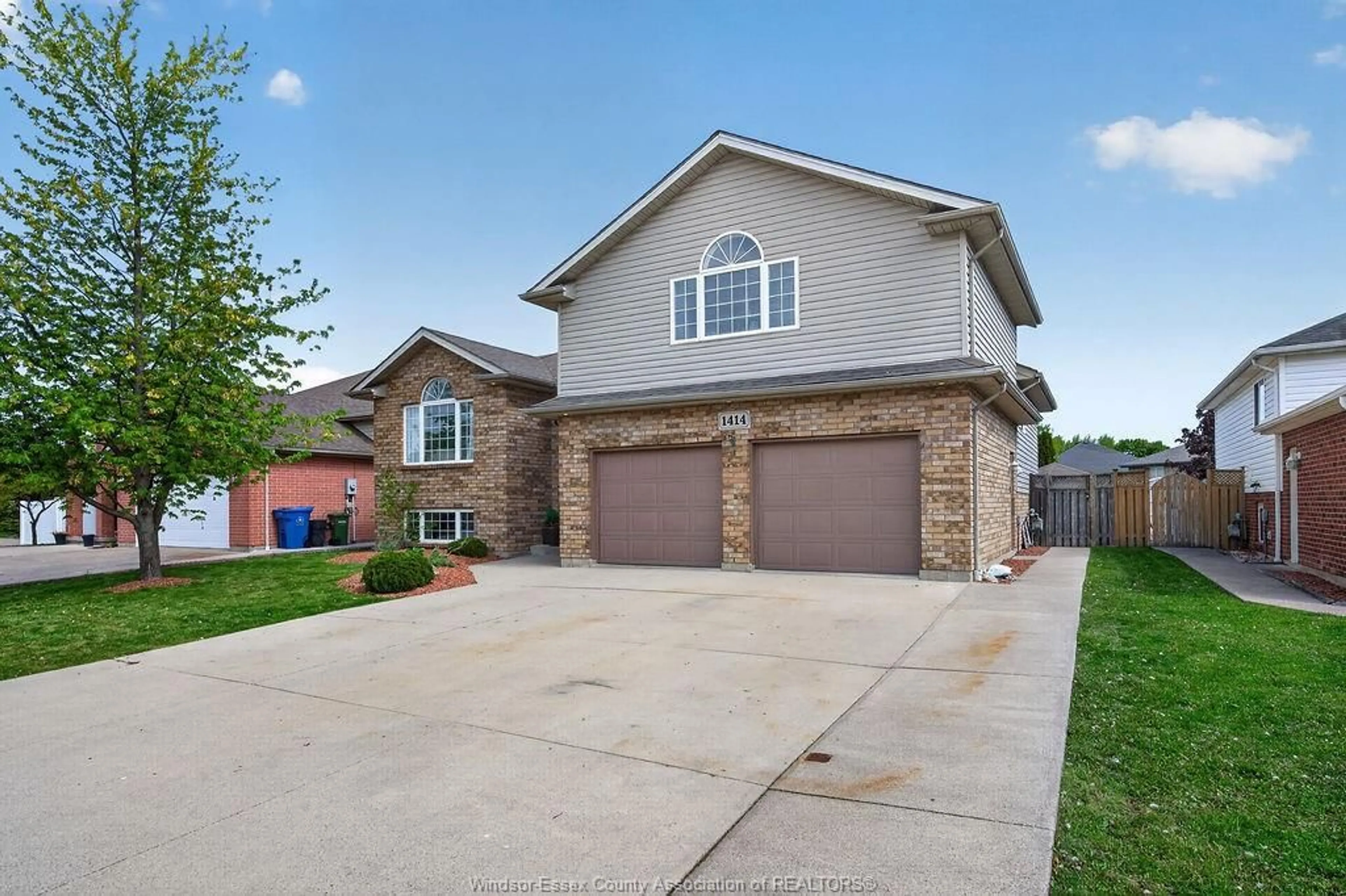 Home with brick exterior material, street for 1414 GIRARD Dr, Lakeshore Ontario N0R 1A0