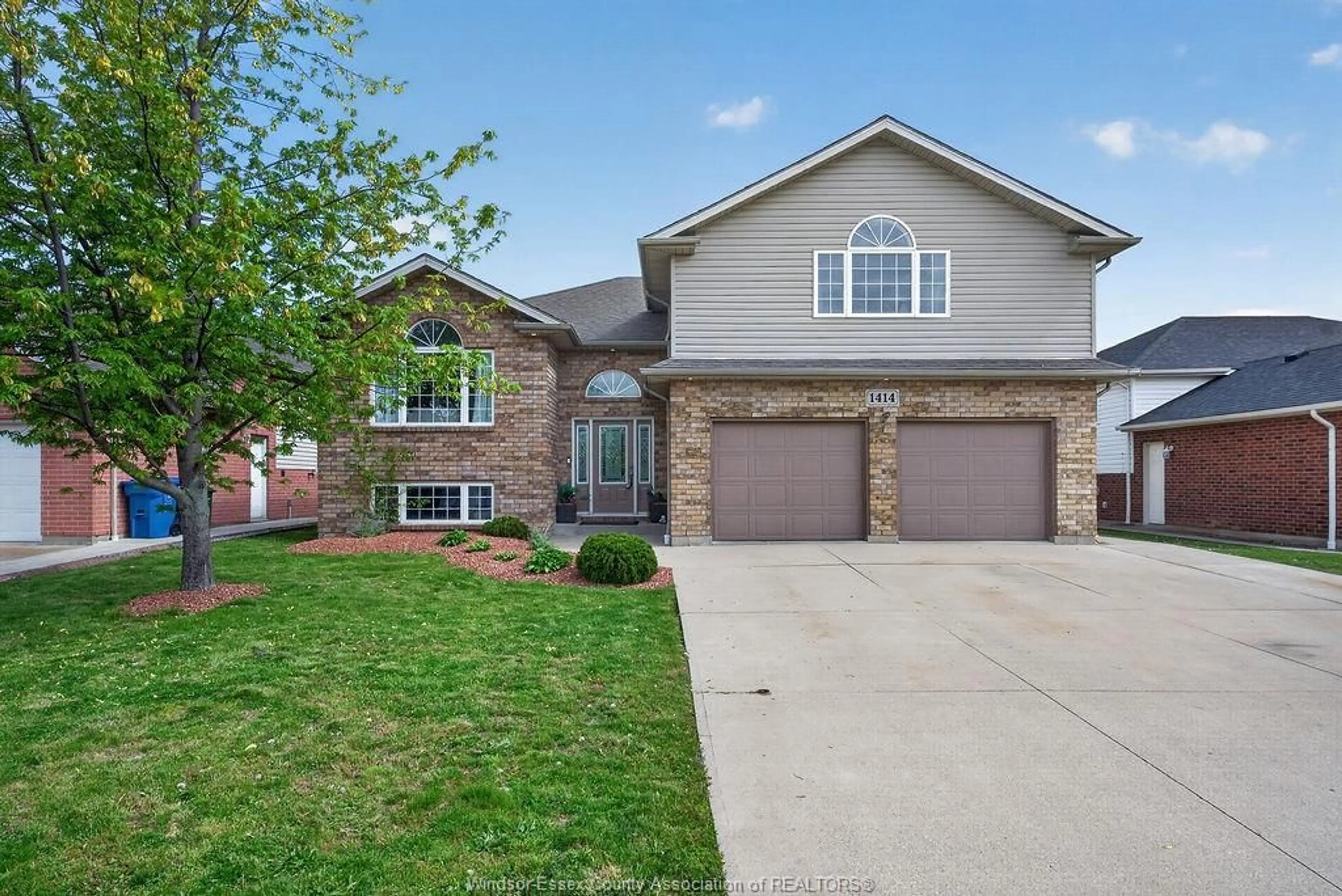 Home with brick exterior material, street for 1414 GIRARD Dr, Lakeshore Ontario N0R 1A0