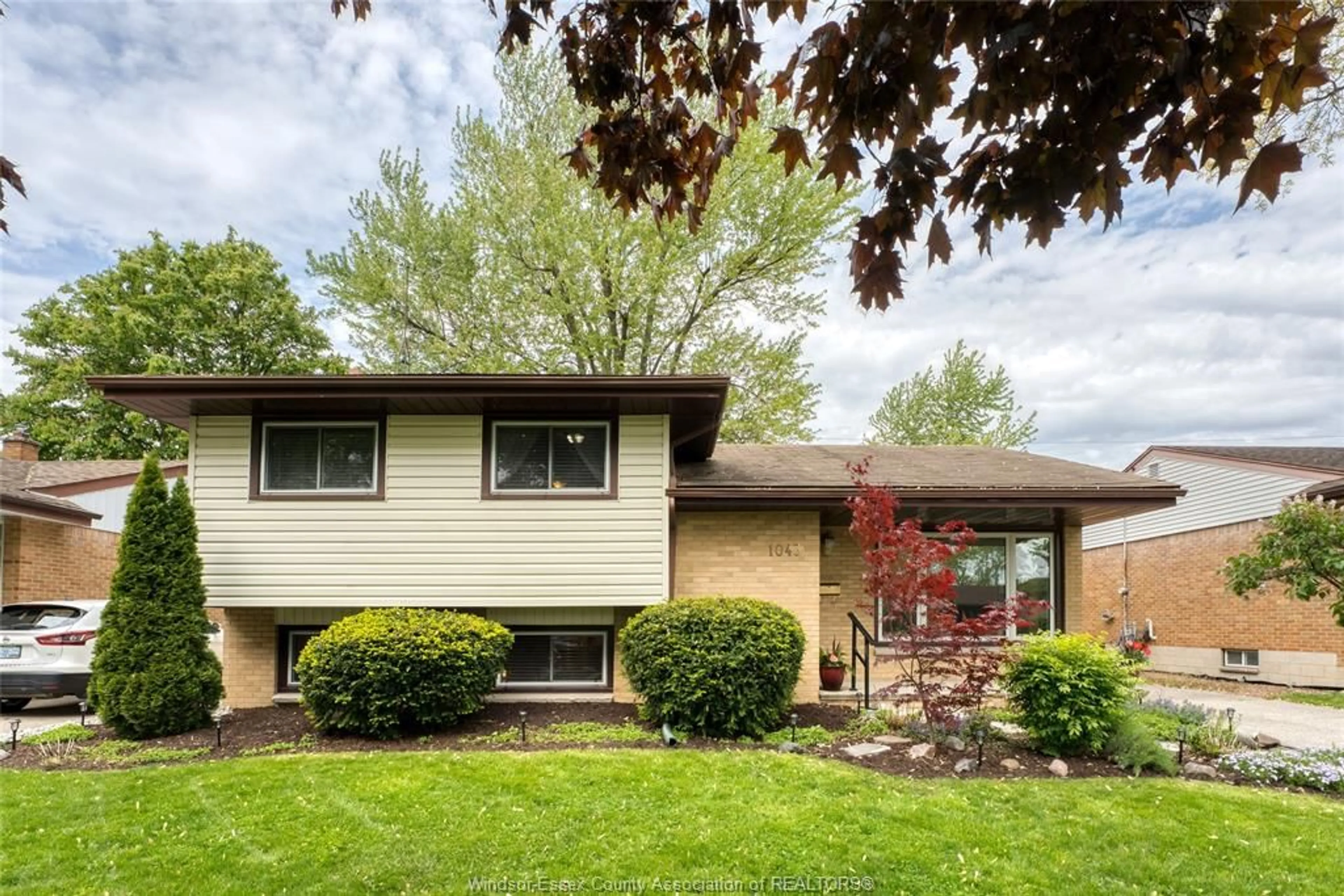 Home with vinyl exterior material, street for 1043 WESTCHESTER Dr, Windsor Ontario N8S 3Z1