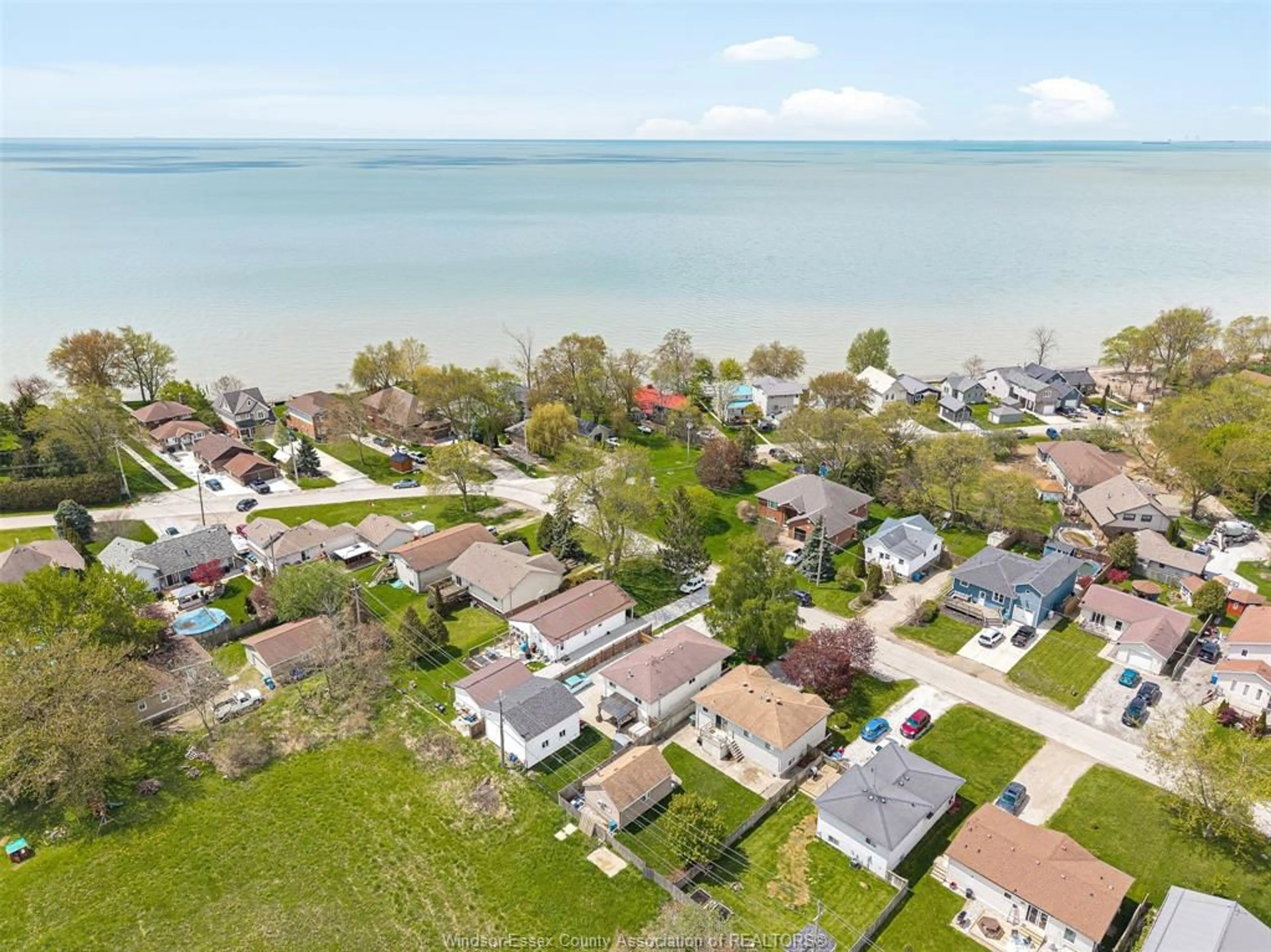 A pic from outside/outdoor area/front of a property/back of a property/a pic from drone, water/lake/river/ocean view for 114 GLOUCESTER Dr, Colchester Ontario N0R 1G0