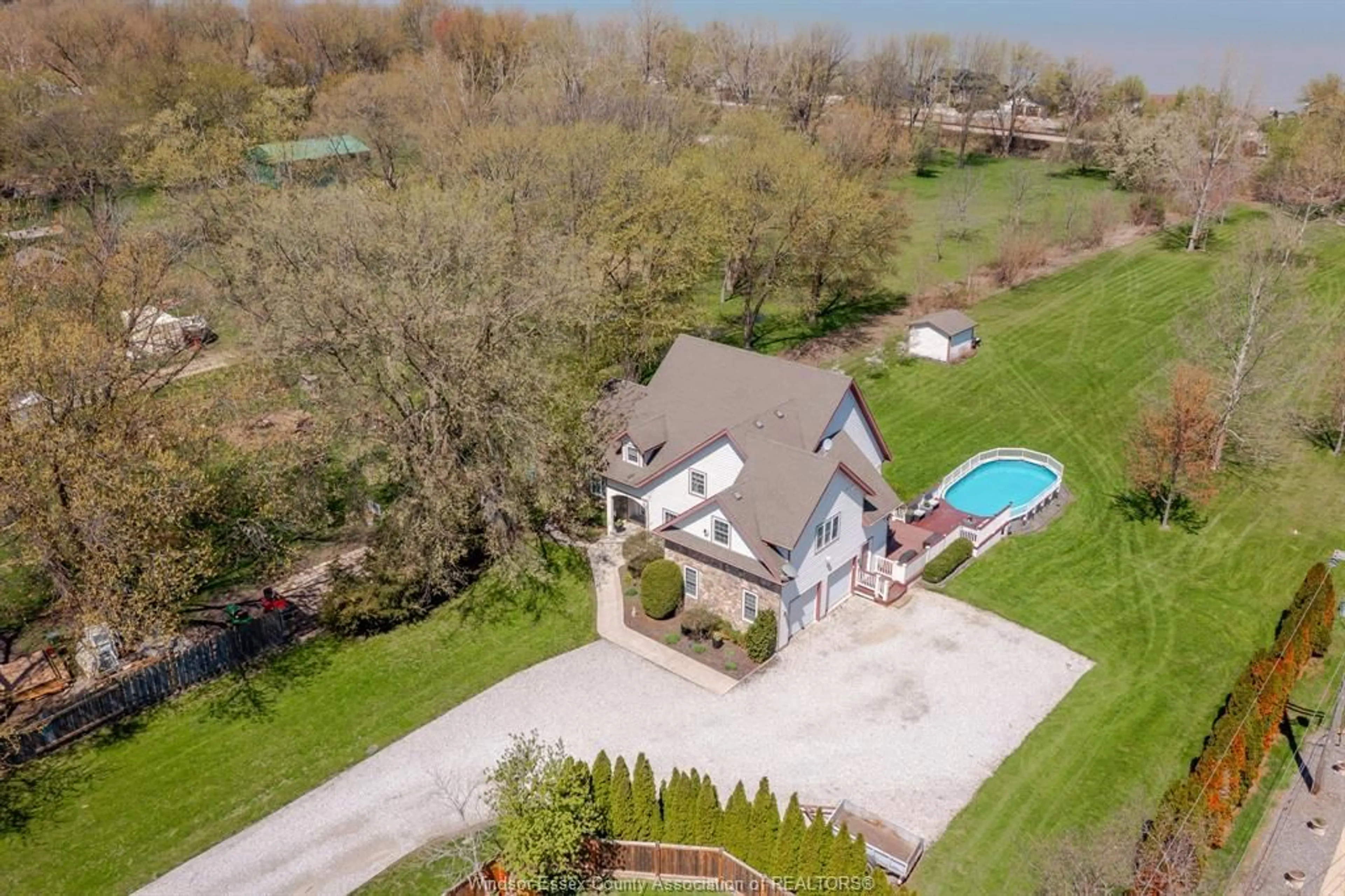 A pic from outside/outdoor area/front of a property/back of a property/a pic from drone, water/lake/river/ocean view for 1332 COUNTY RD 22, Lakeshore Ontario N0R 1A0