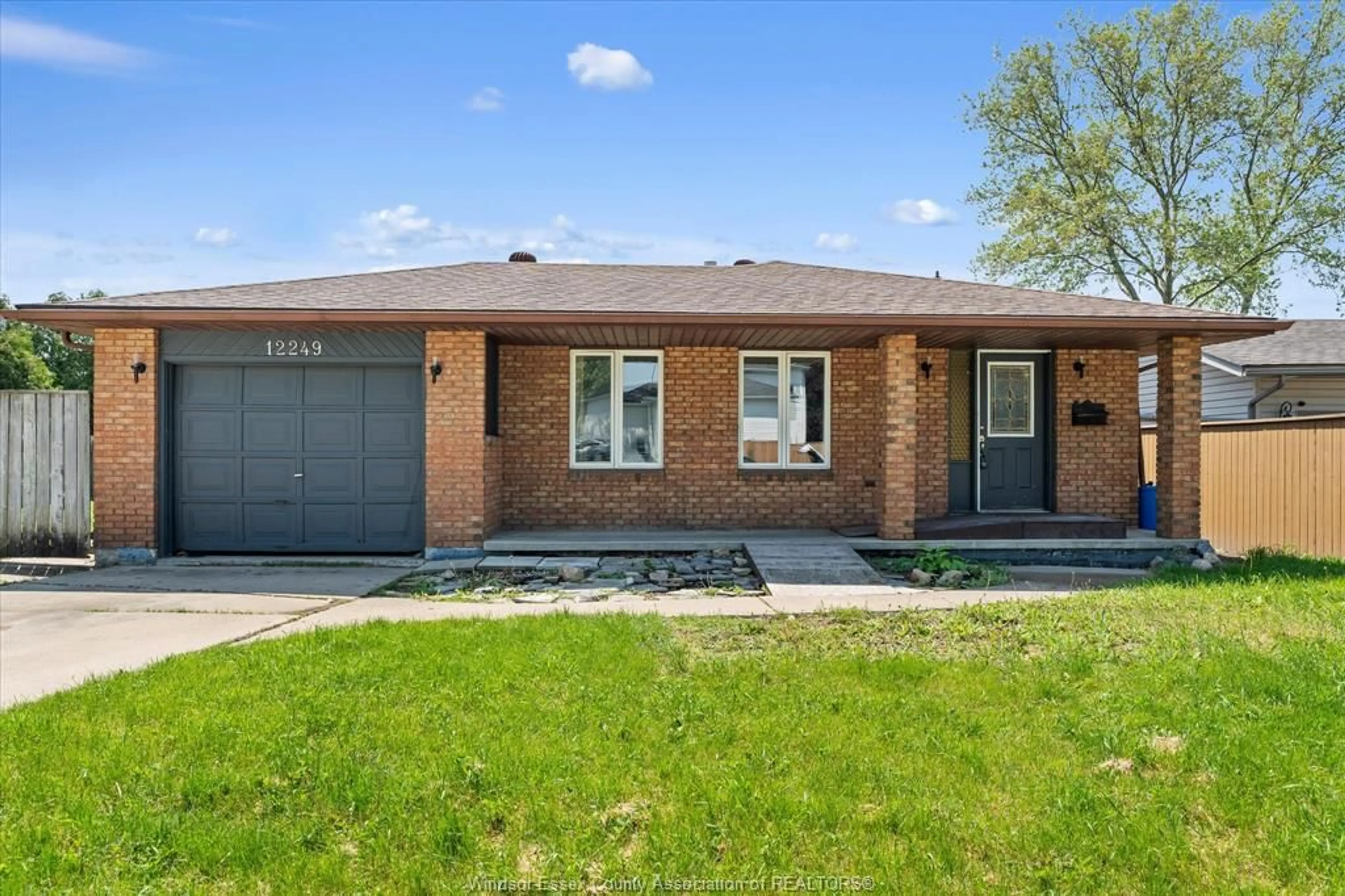 Home with brick exterior material, street for 12249 PAPINEAU Crt, Tecumseh Ontario N8N 3B5
