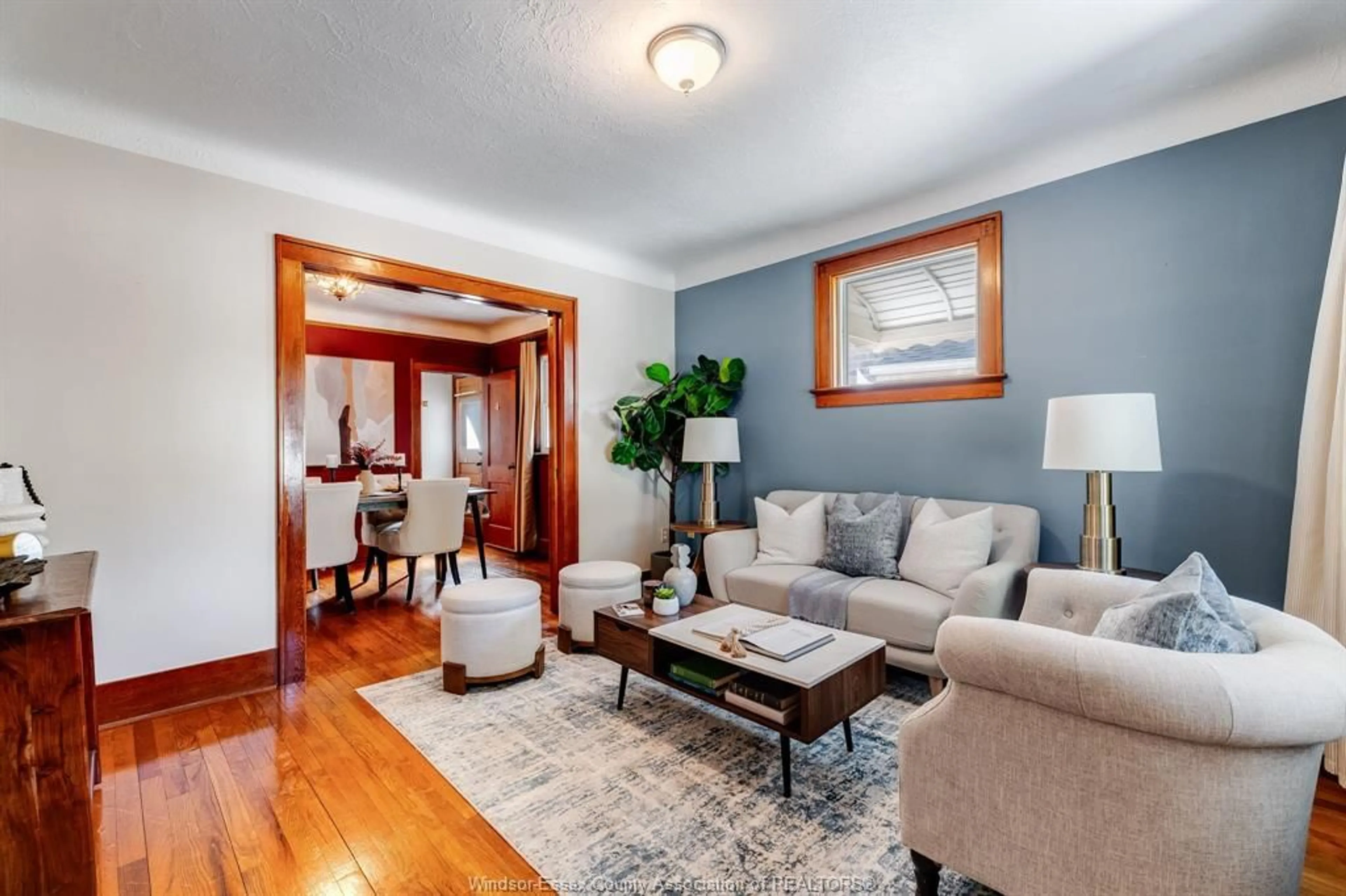 Living room with furniture, wood/laminate floor for 1668 Ford Blvd, Windsor Ontario N8T 2E1