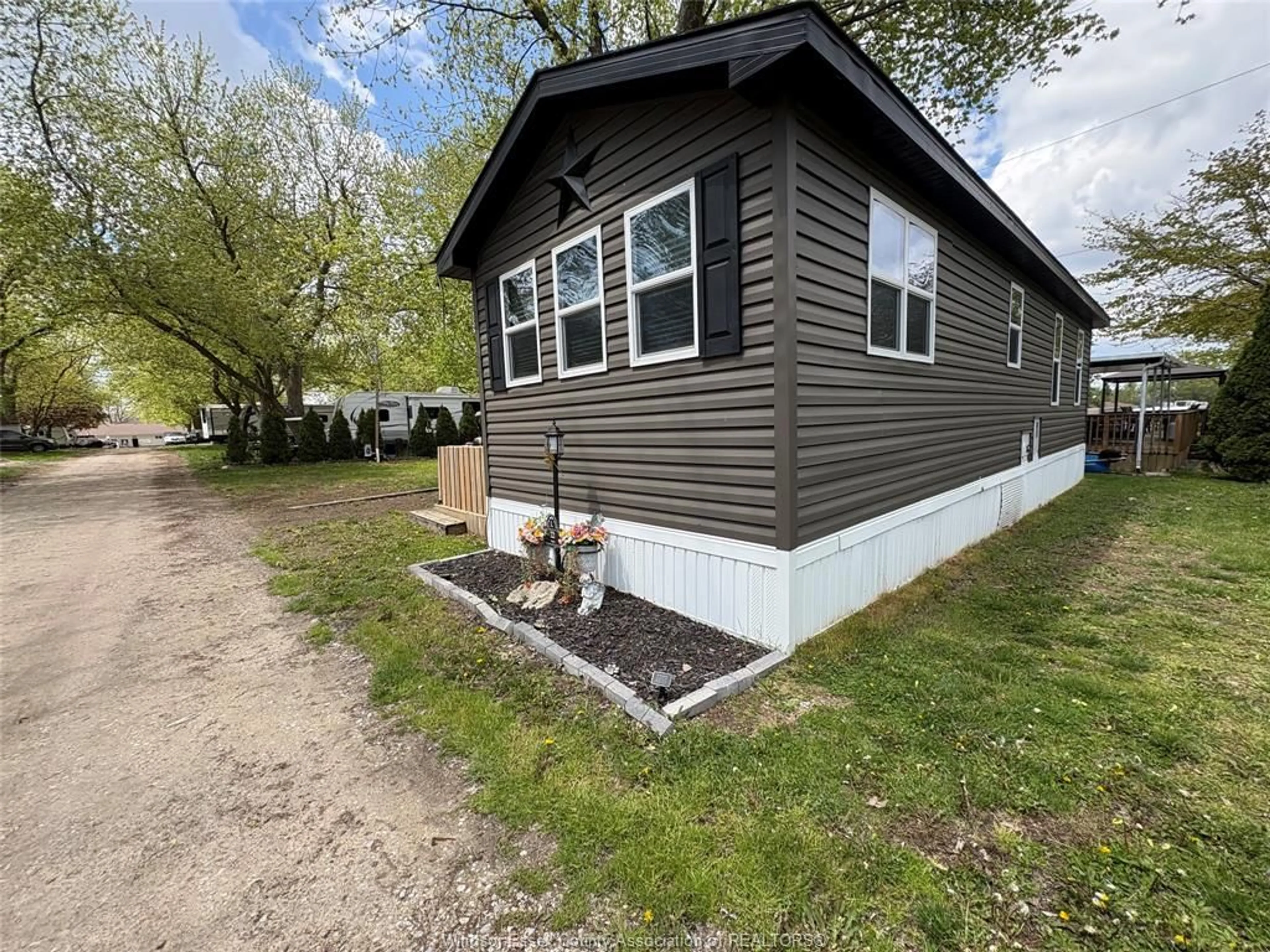 Home with vinyl exterior material, street for 22 POPLAR Lane, Leamington Ontario N0P 2G0