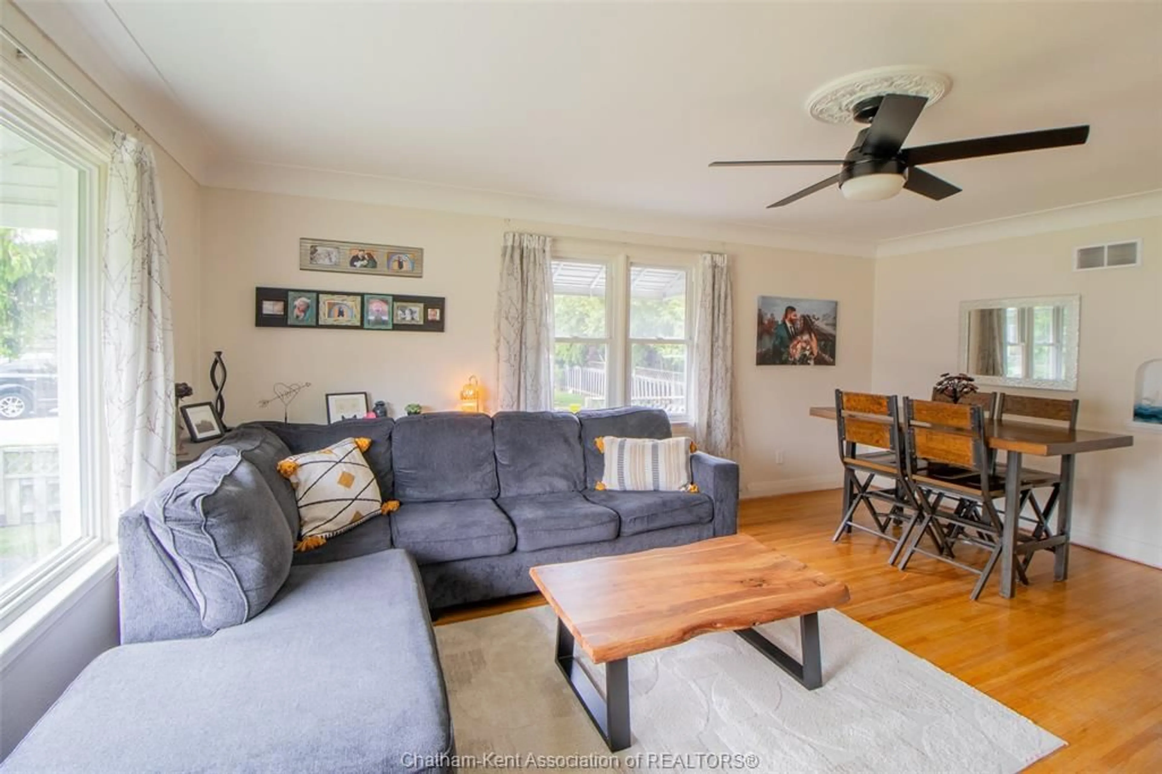 Living room with furniture, wood/laminate floor for 135 Alexandra Ave, Chatham Ontario N7M 1Y4