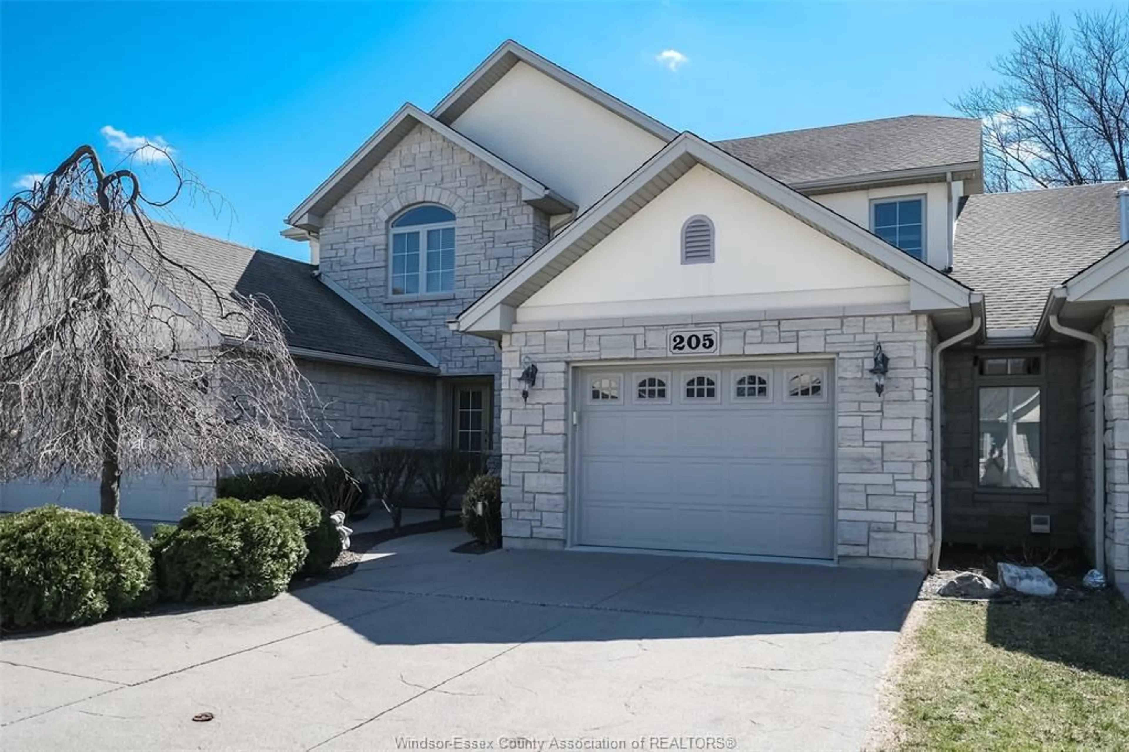 Home with brick exterior material, street for 205 WHISPER CREEK, Lakeshore Ontario N9K 1G3