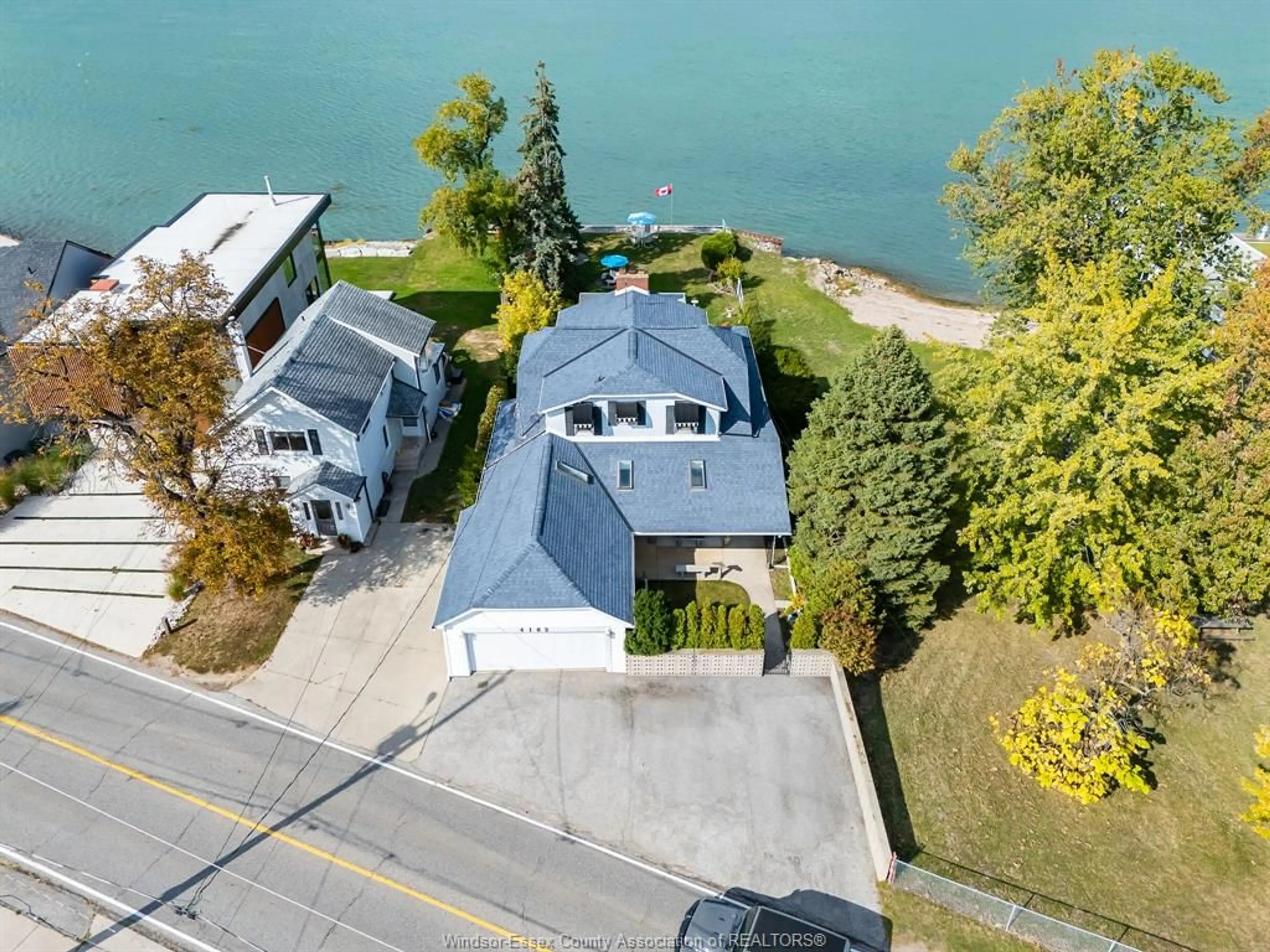 A pic from outside/outdoor area/front of a property/back of a property/a pic from drone, water/lake/river/ocean view for 4182 Riverside Dr, Windsor Ontario N8Y 1B5