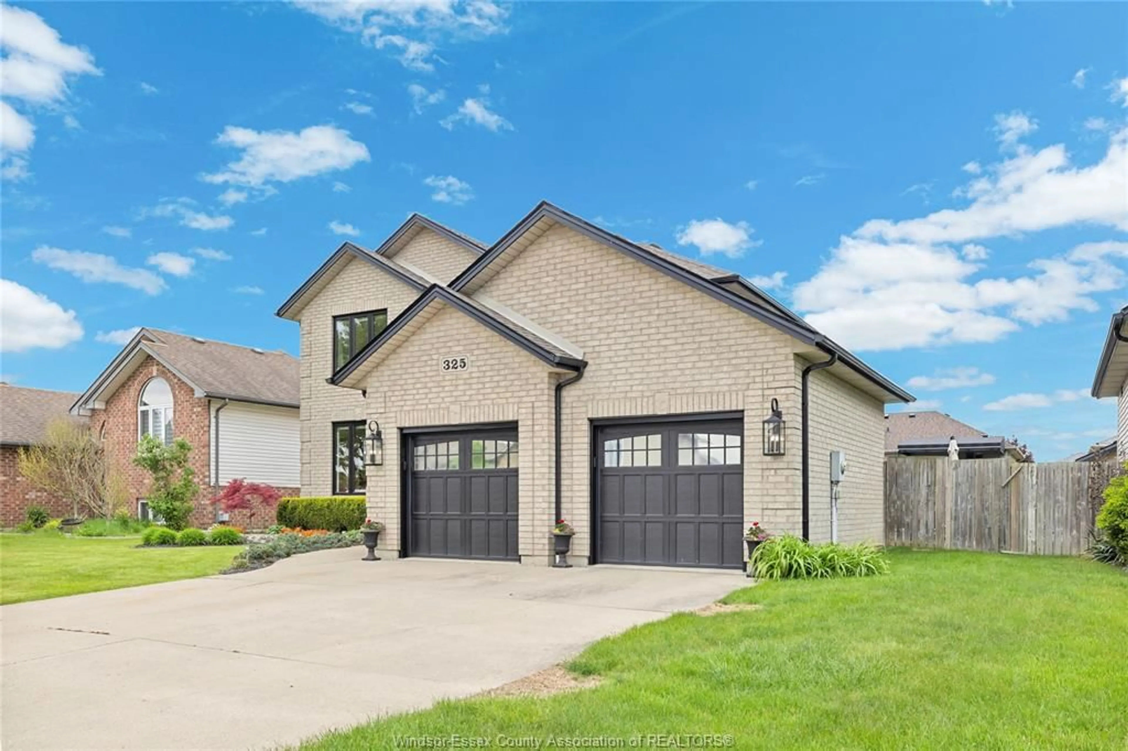 Home with brick exterior material, street for 325 CORETTI Dr, Lakeshore Ontario N0R 1A0