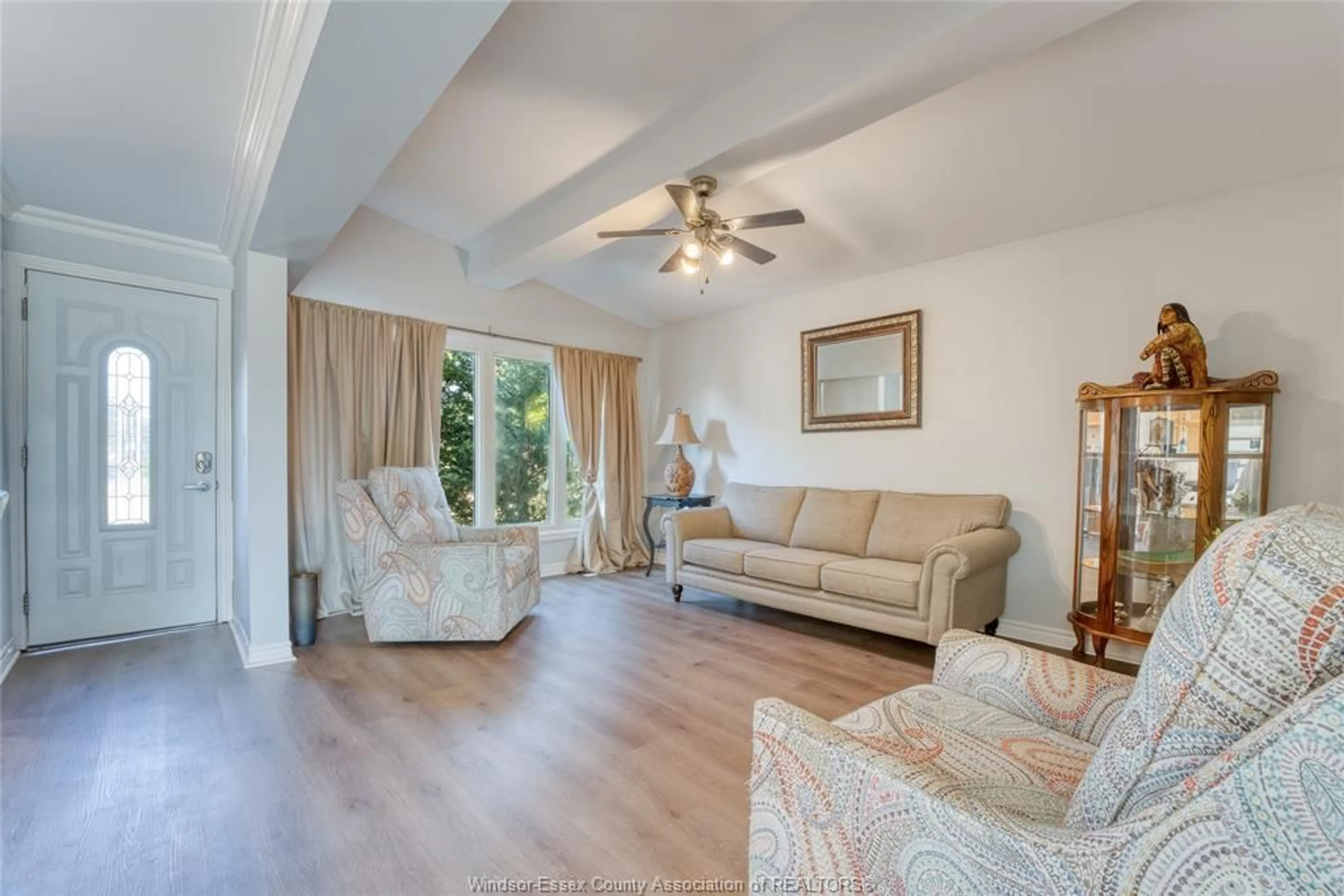 Living room with furniture, wood/laminate floor for 426 LESPERANCE Rd, Tecumseh Ontario N8N 1W4