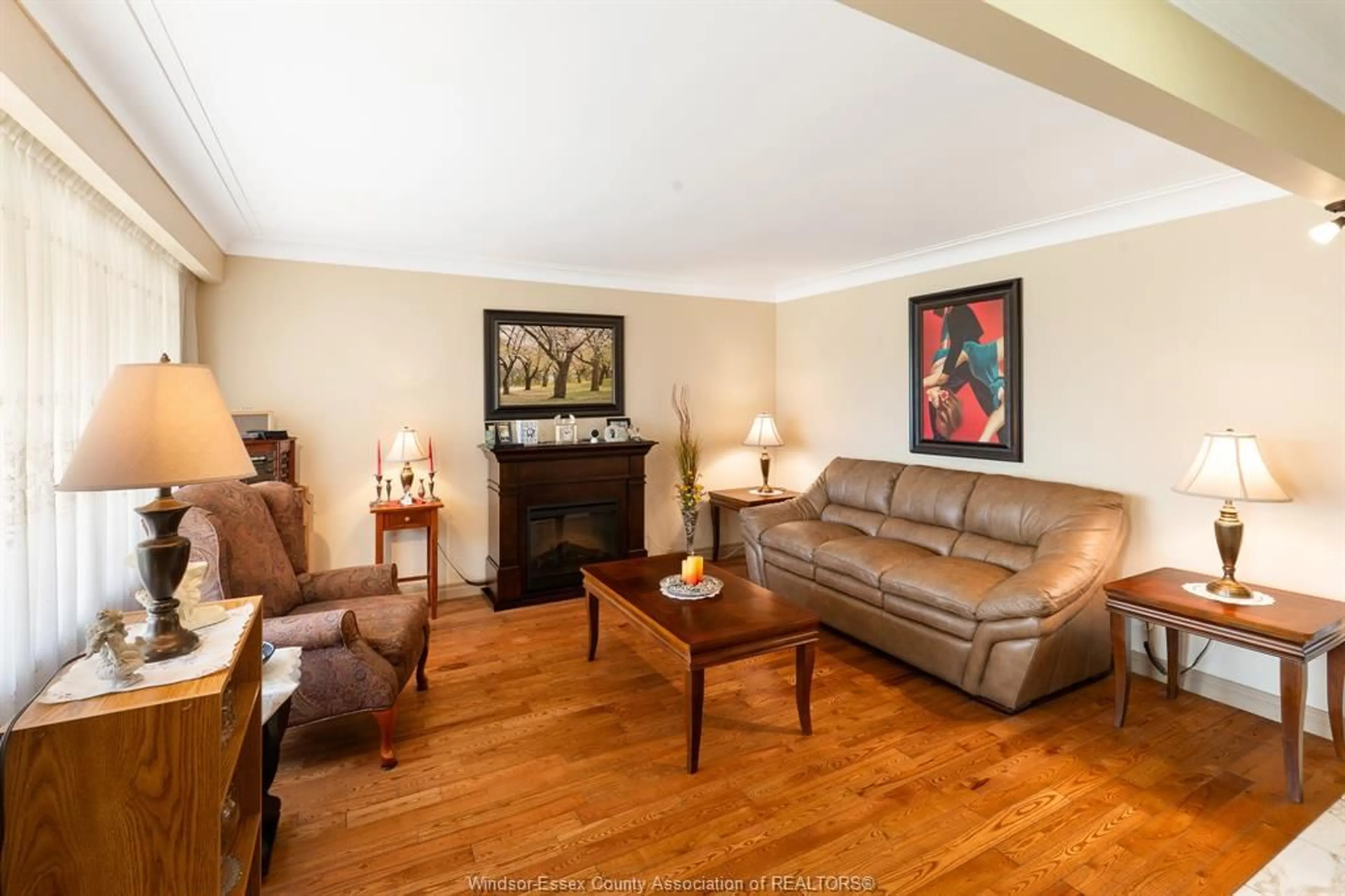 Living room with furniture, wood/laminate floor for 2444 Rivard Ave, Windsor Ontario N8T 2H2