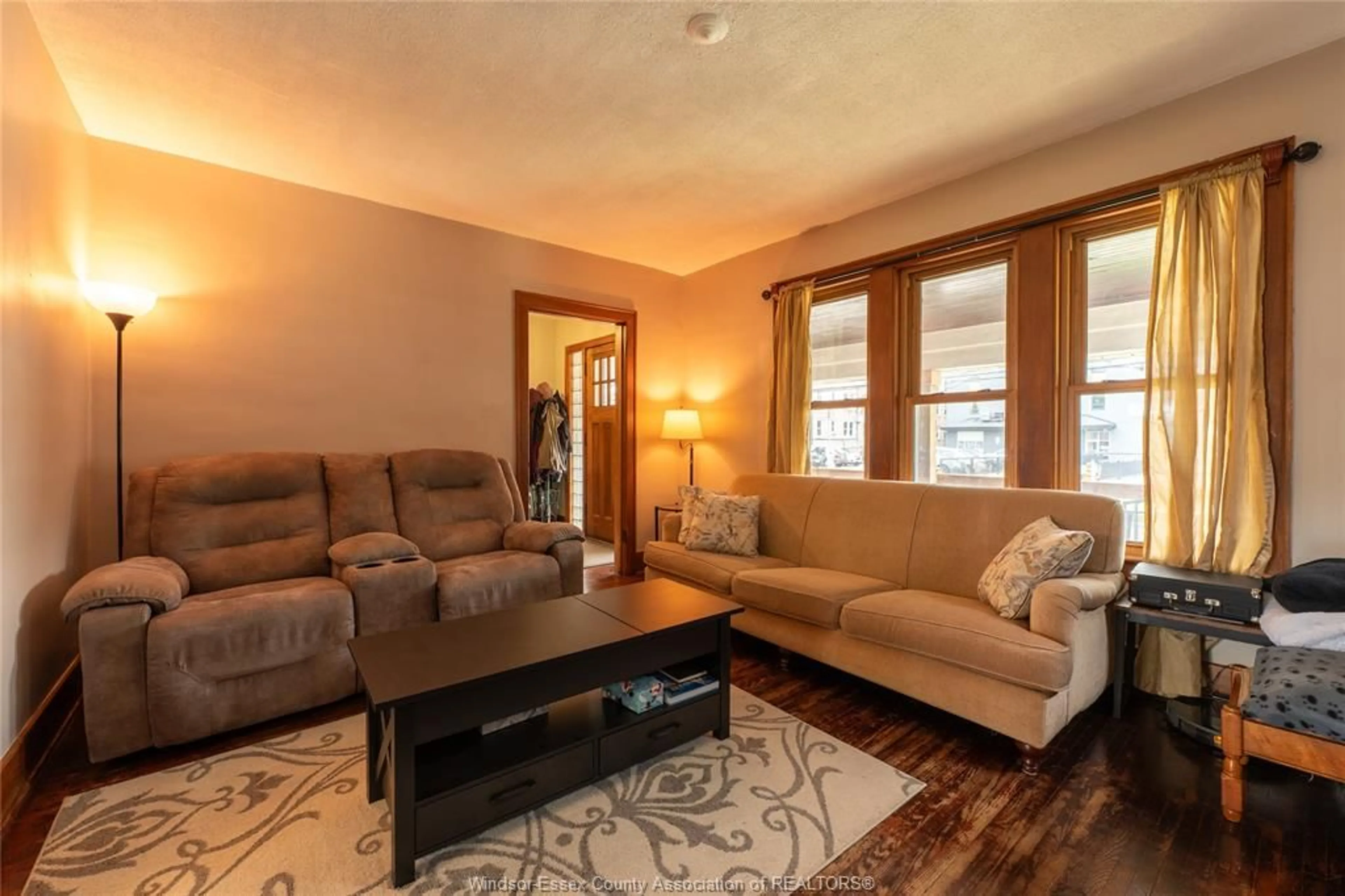 Living room with furniture, wood/laminate floor for 1366 Dufferin Pl, Windsor Ontario N8X 3K1