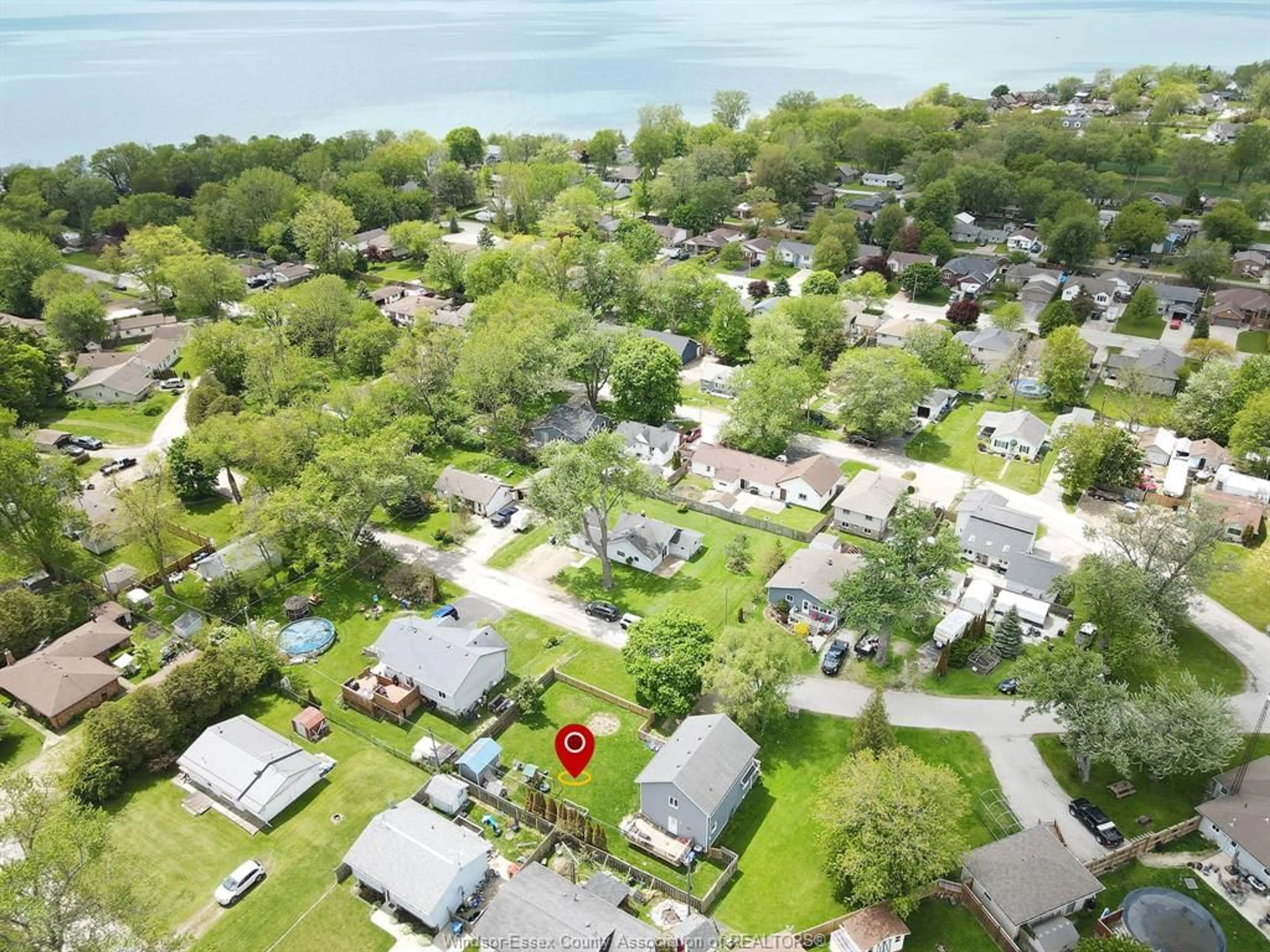 A pic from outside/outdoor area/front of a property/back of a property/a pic from drone, water/lake/river/ocean view for 154 LINCOLN CRT, Colchester Ontario N0R 1G0