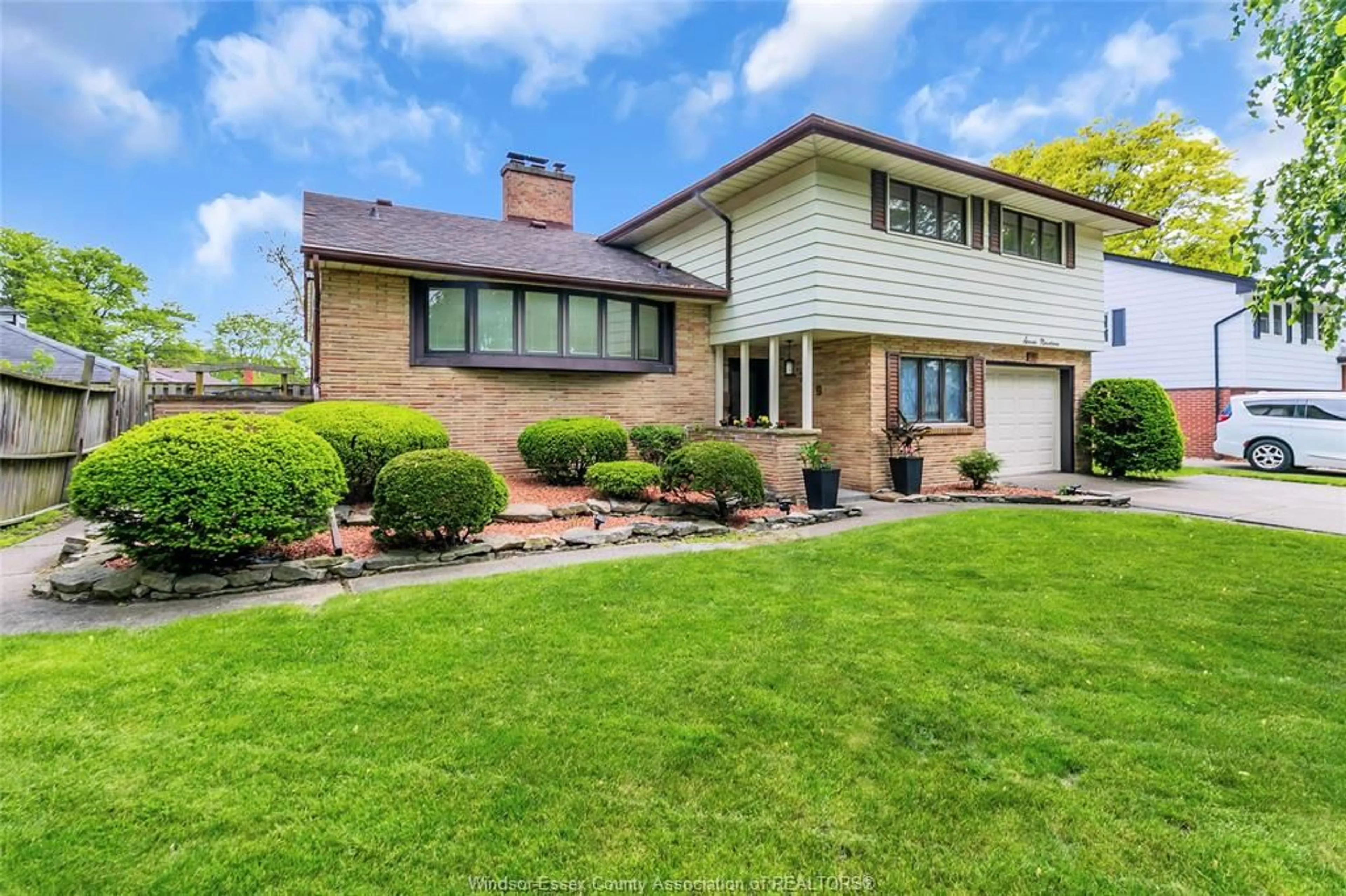 Home with brick exterior material, street for 719 CHAMPLAIN Dr, Windsor Ontario N9E 1M6