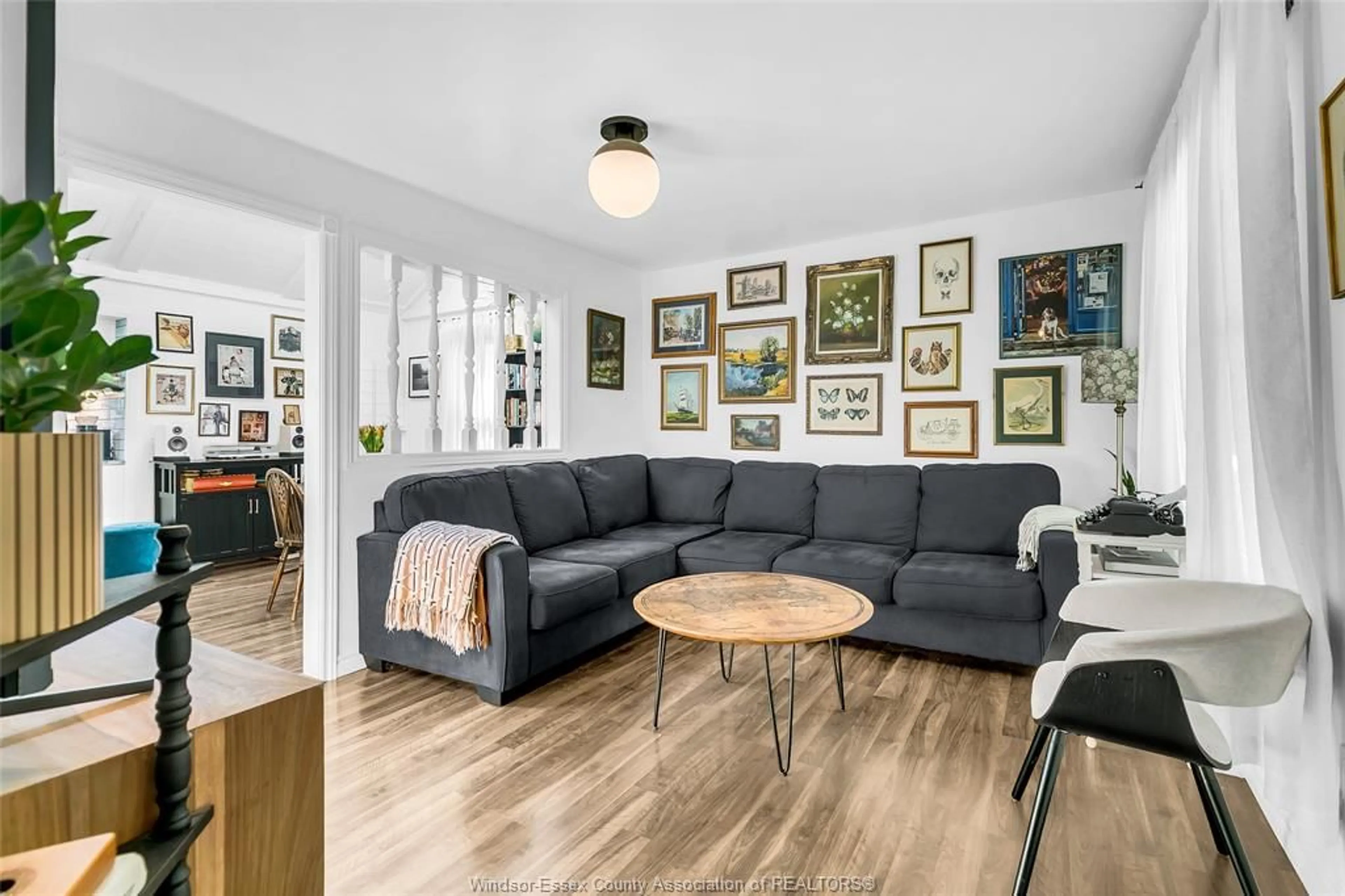 Living room with furniture, wood/laminate floor for 3548 TURNER Rd, Windsor Ontario N8W 3M8
