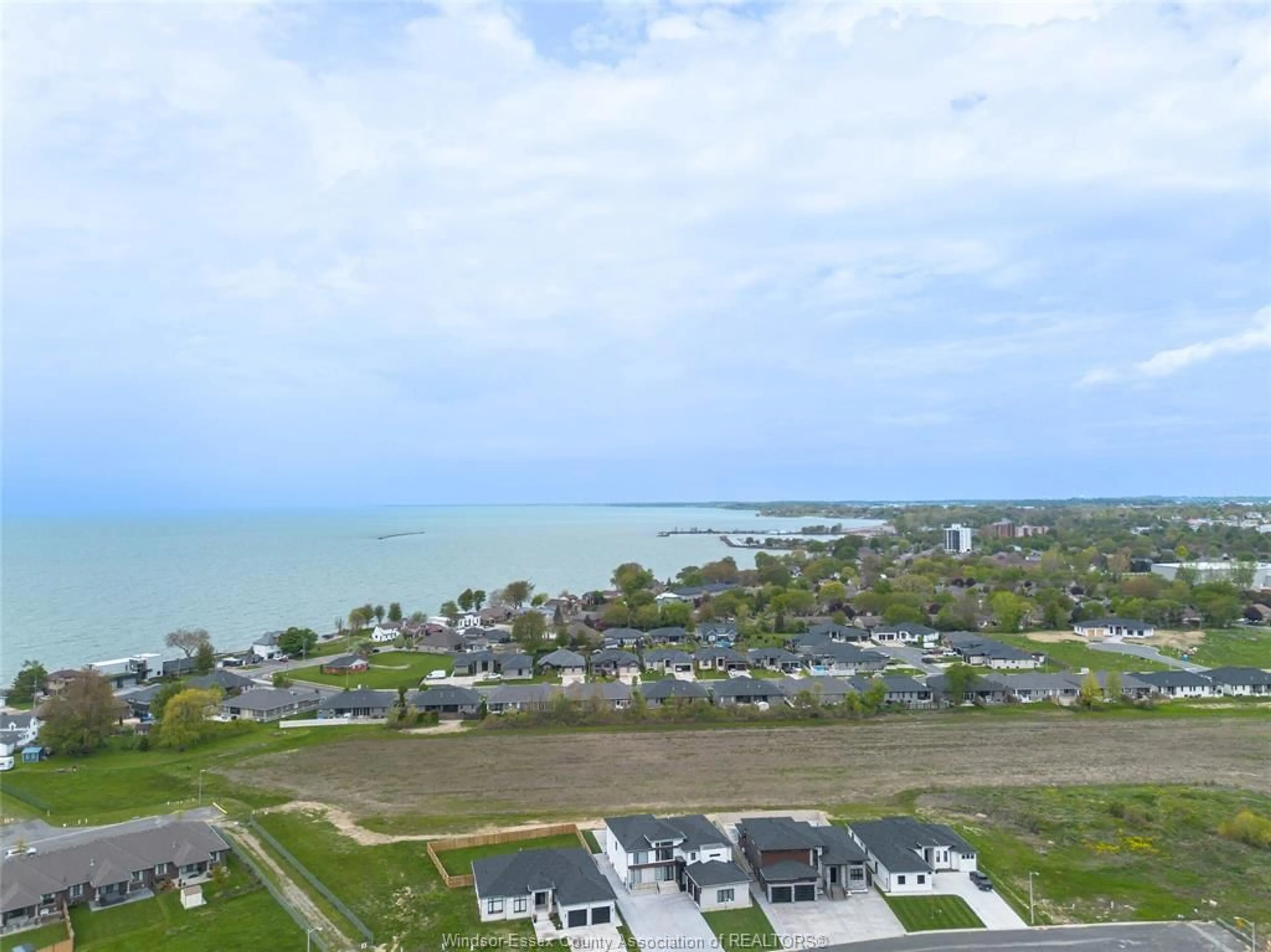 A pic from outside/outdoor area/front of a property/back of a property/a pic from drone, water/lake/river/ocean view for 7 CYPRESS POINTE, Leamington Ontario N8H 5R2