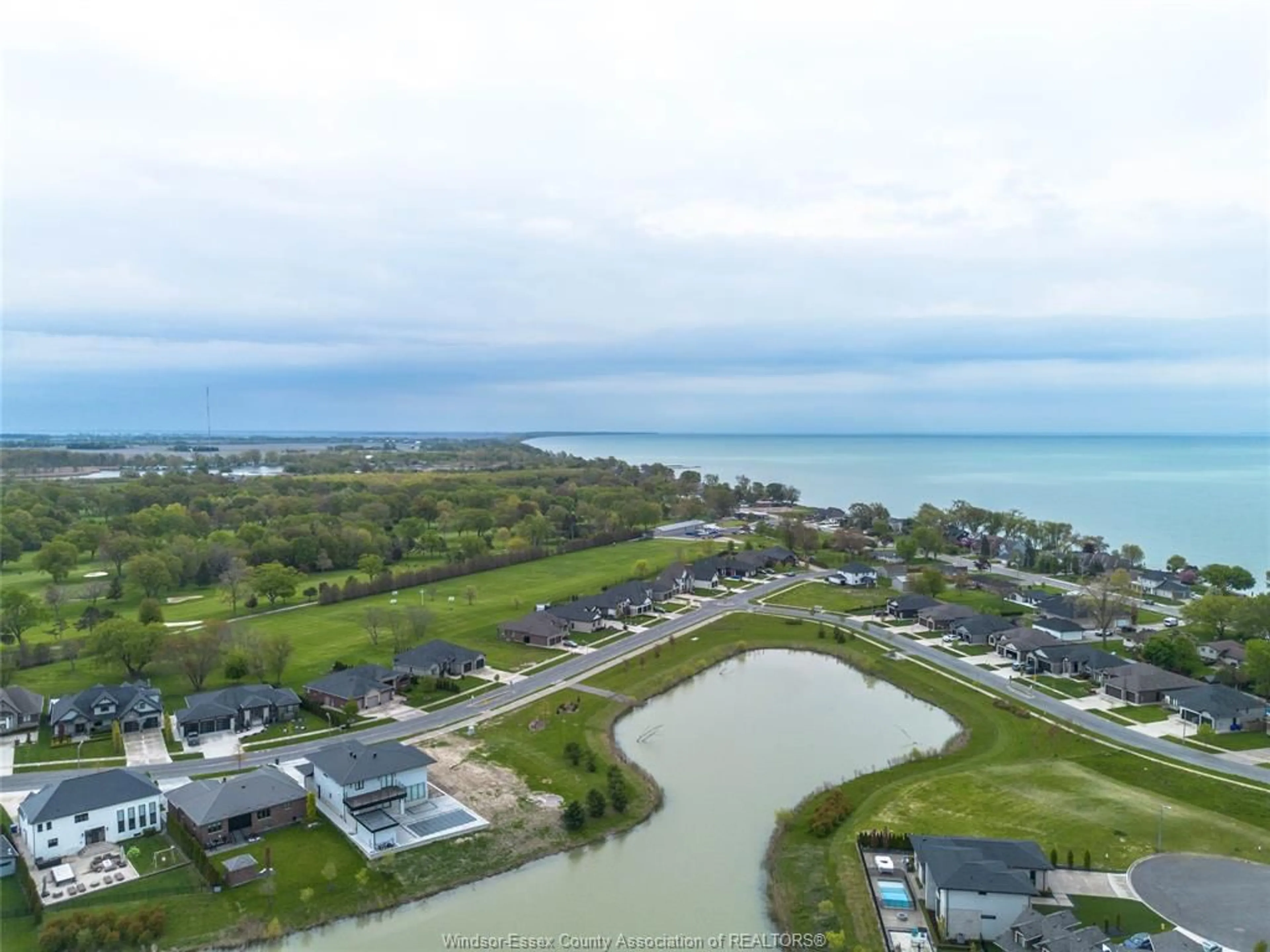 A pic from outside/outdoor area/front of a property/back of a property/a pic from drone, water/lake/river/ocean view for 7 CYPRESS POINTE, Leamington Ontario N8H 5R2