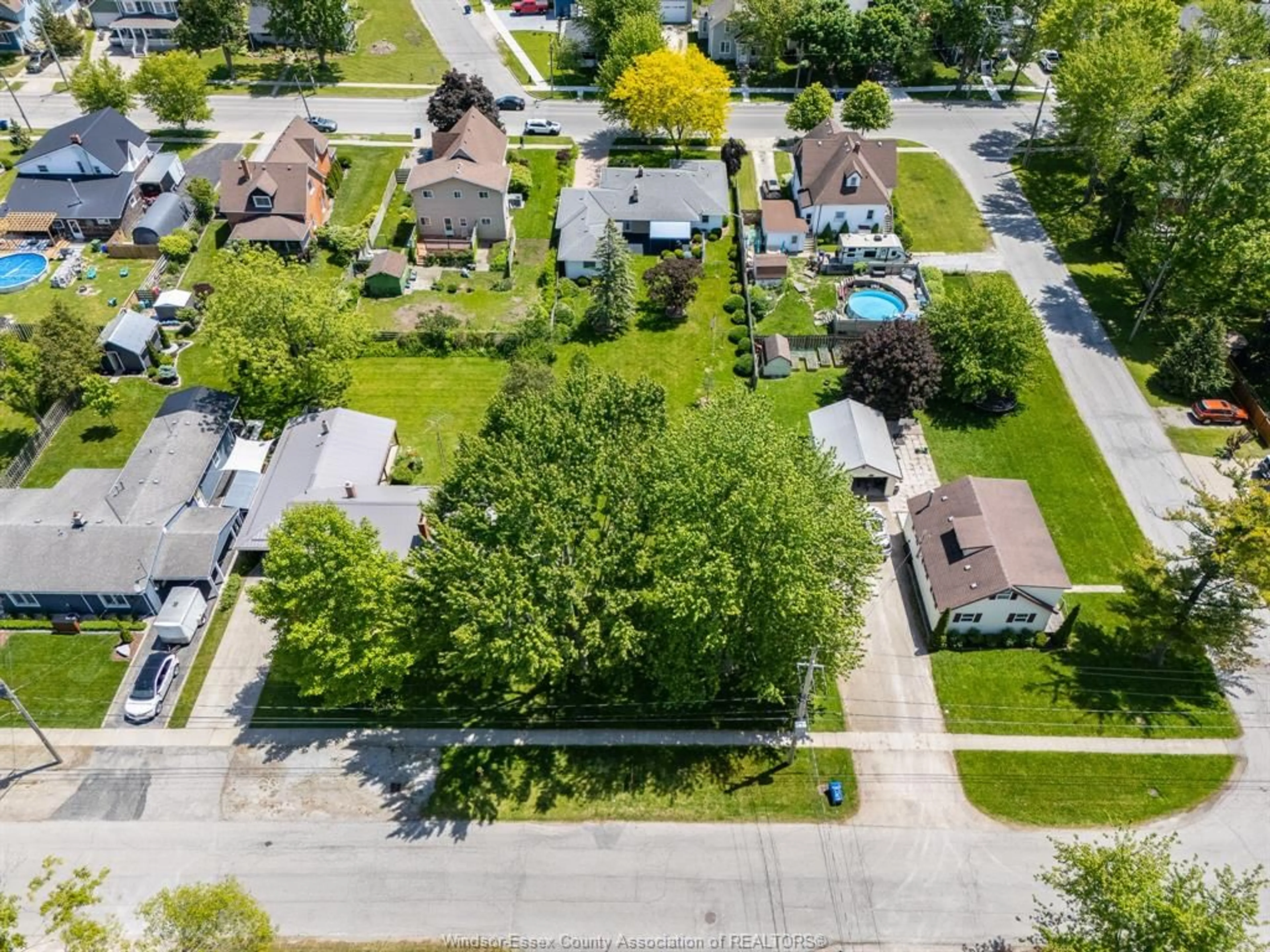 A pic from outside/outdoor area/front of a property/back of a property/a pic from drone, street for 105 Baird, Wheatley Ontario N0P 2P0