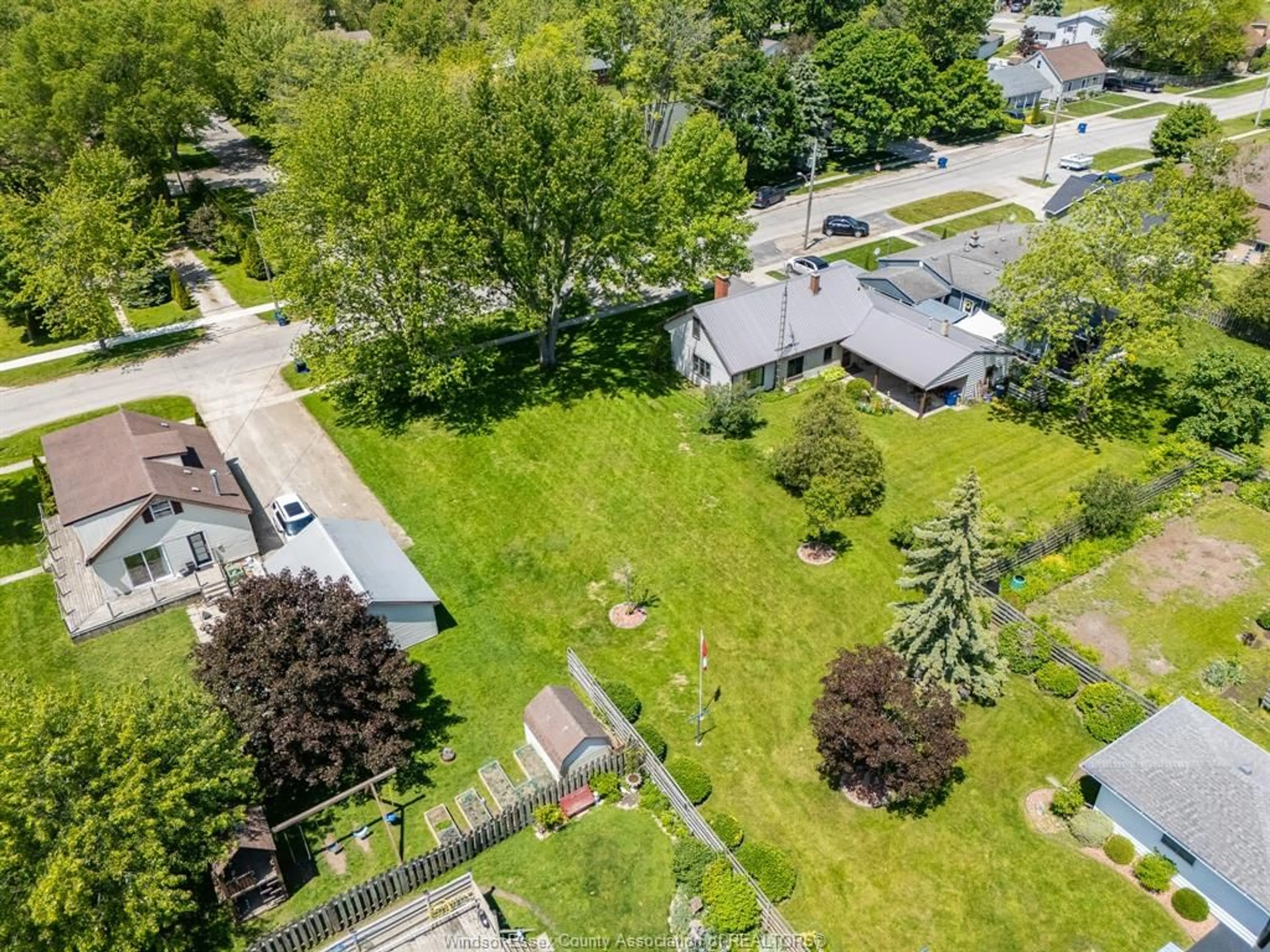 A pic from outside/outdoor area/front of a property/back of a property/a pic from drone, street for 105 Baird, Wheatley Ontario N0P 2P0