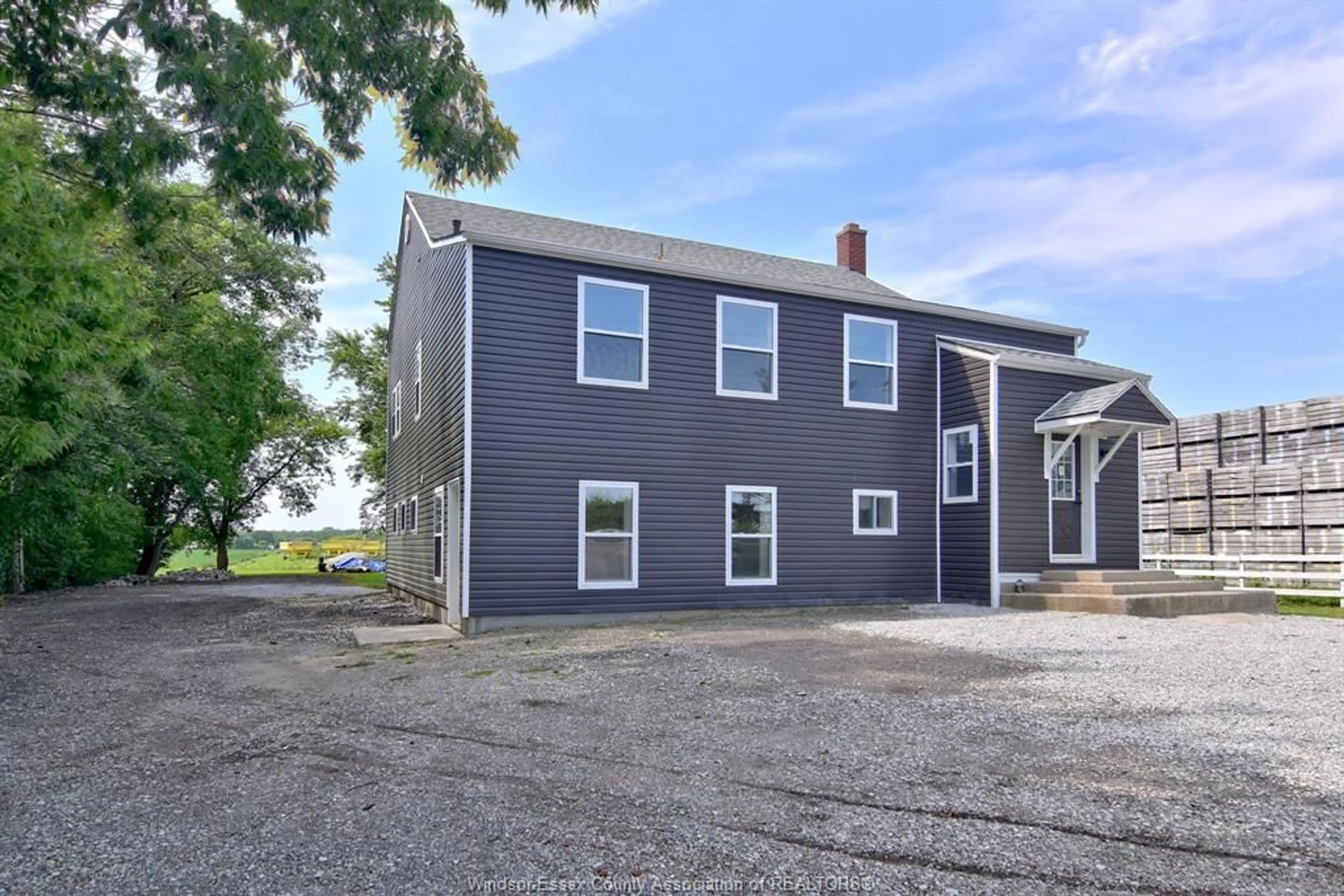 A pic from outside/outdoor area/front of a property/back of a property/a pic from drone, building for 1502 MERSEA RD D, Leamington Ontario N8H 3V4