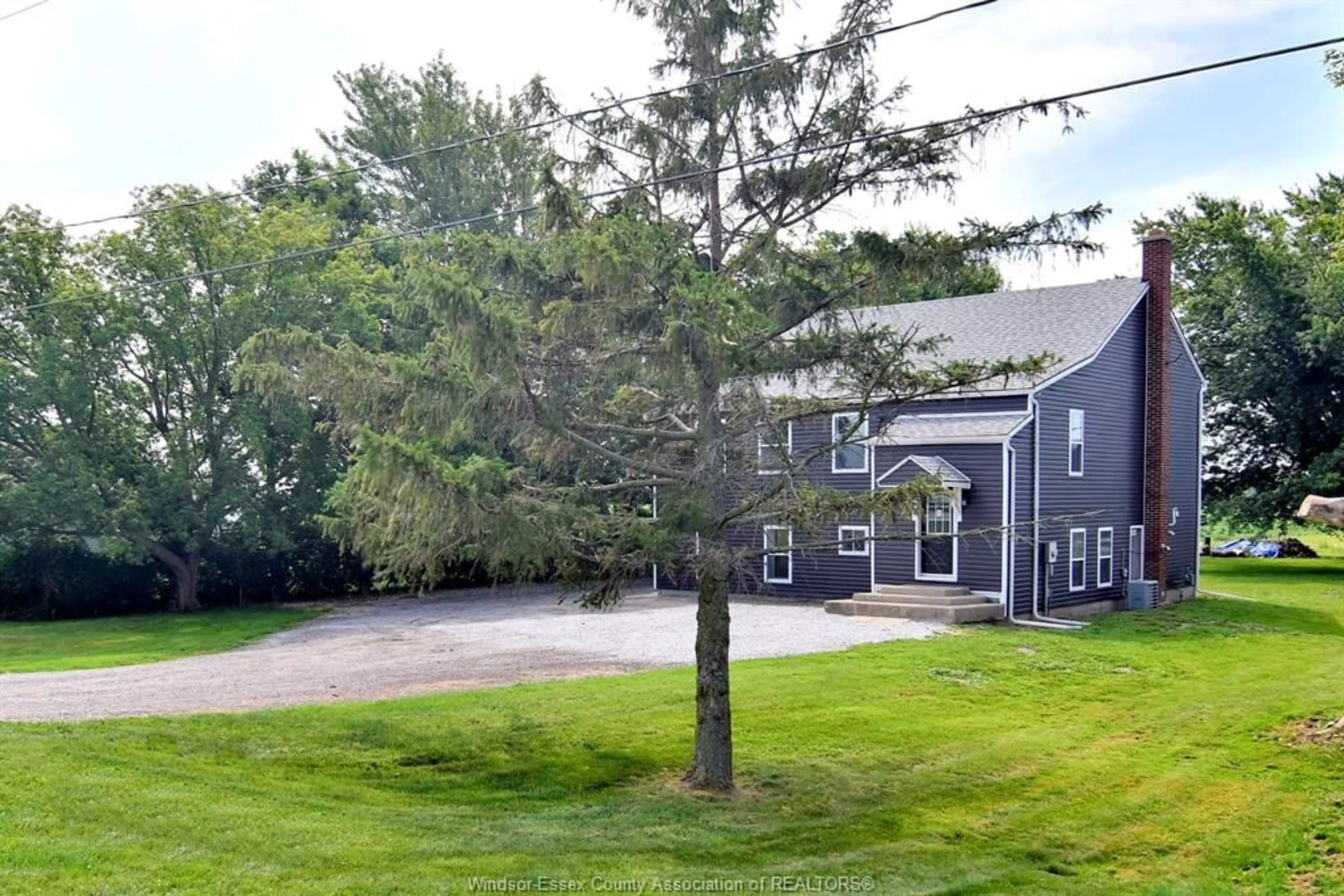 A pic from outside/outdoor area/front of a property/back of a property/a pic from drone, street for 1502 MERSEA RD D, Leamington Ontario N8H 3V4