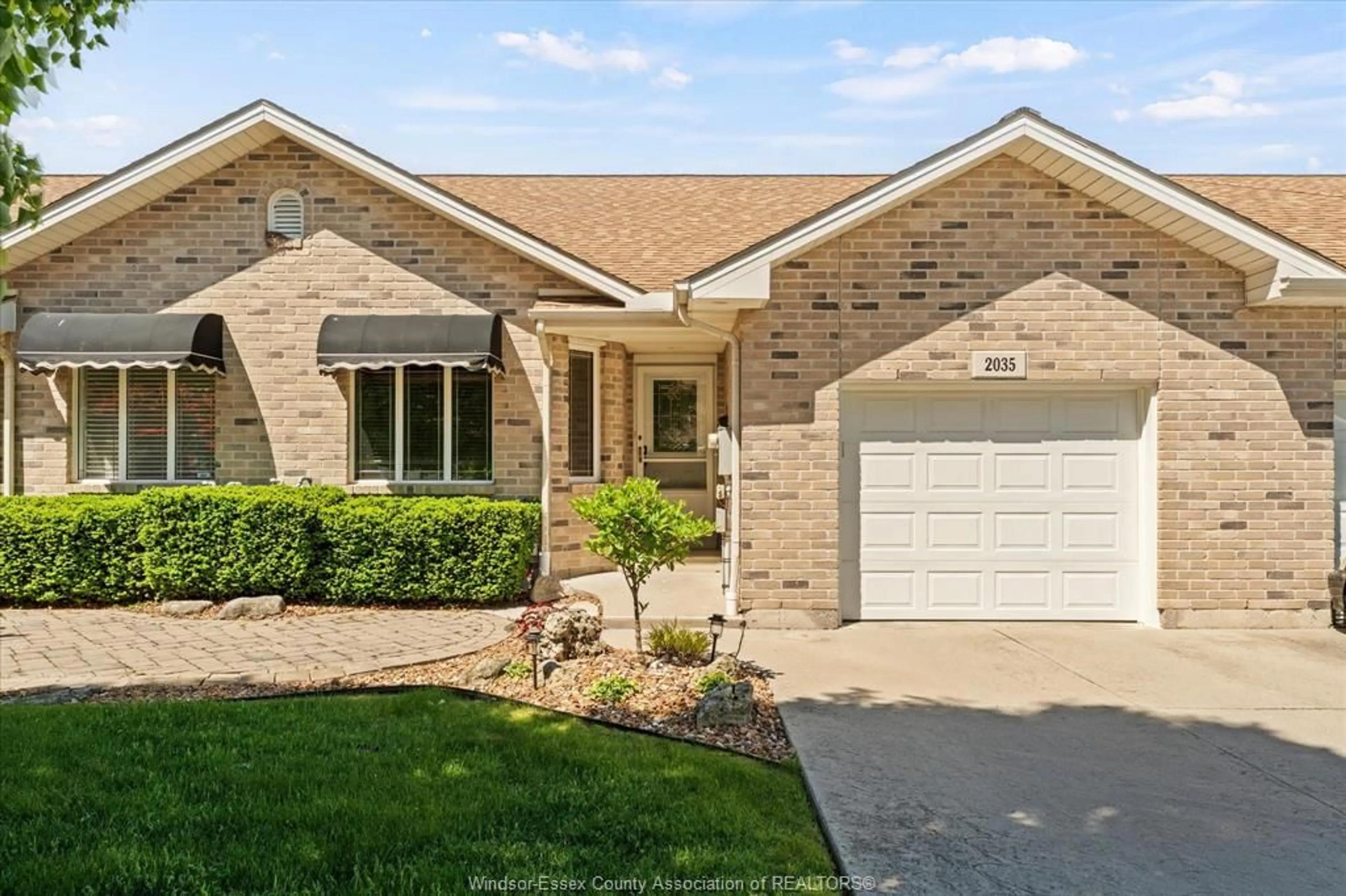 Home with brick exterior material, street for 2035 Morningstar Ave, Windsor Ontario N8P 1W5