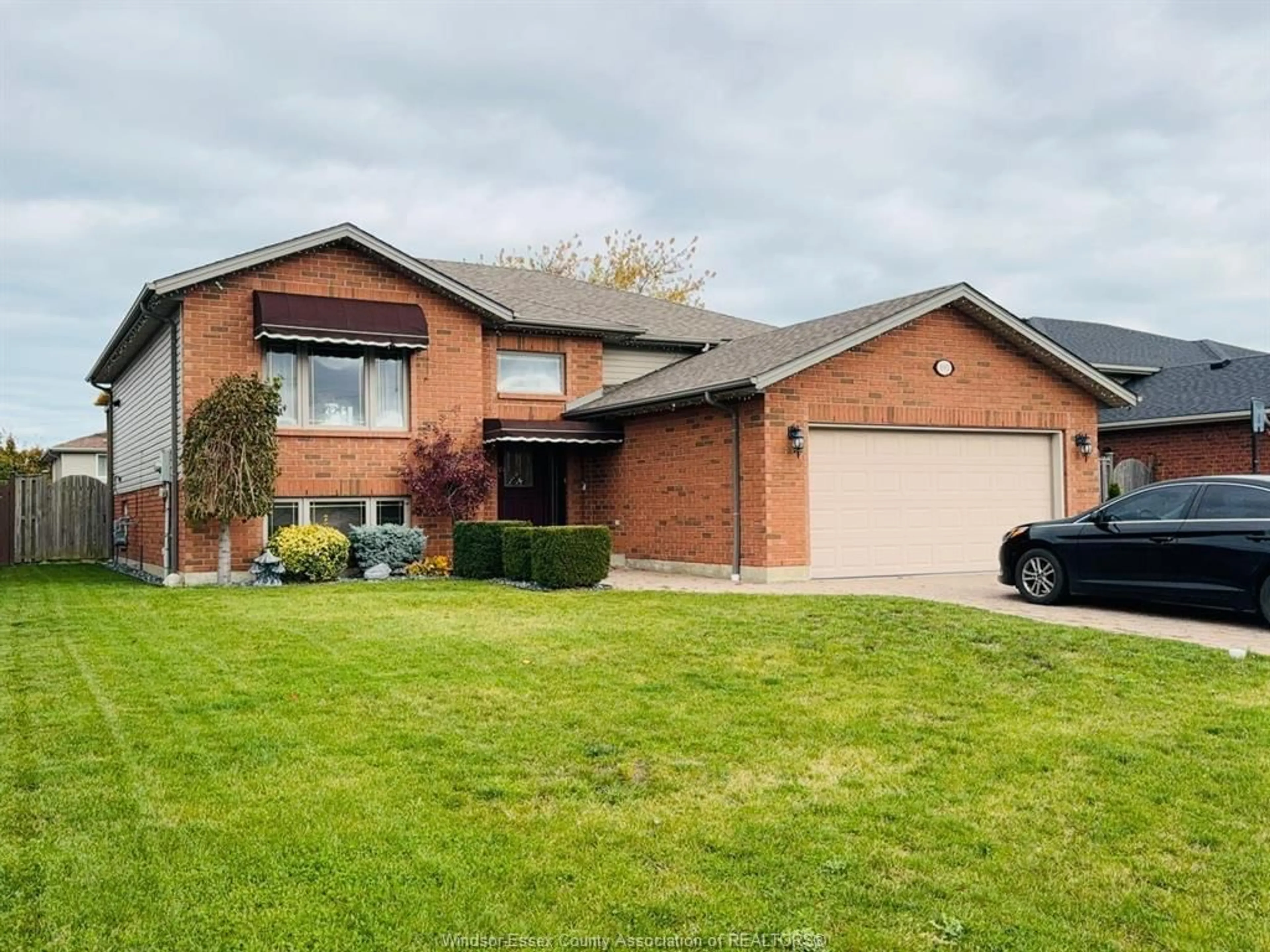 Home with brick exterior material, street for 890 SOUTHWOOD Dr, Lakeshore Ontario N0R 1A0