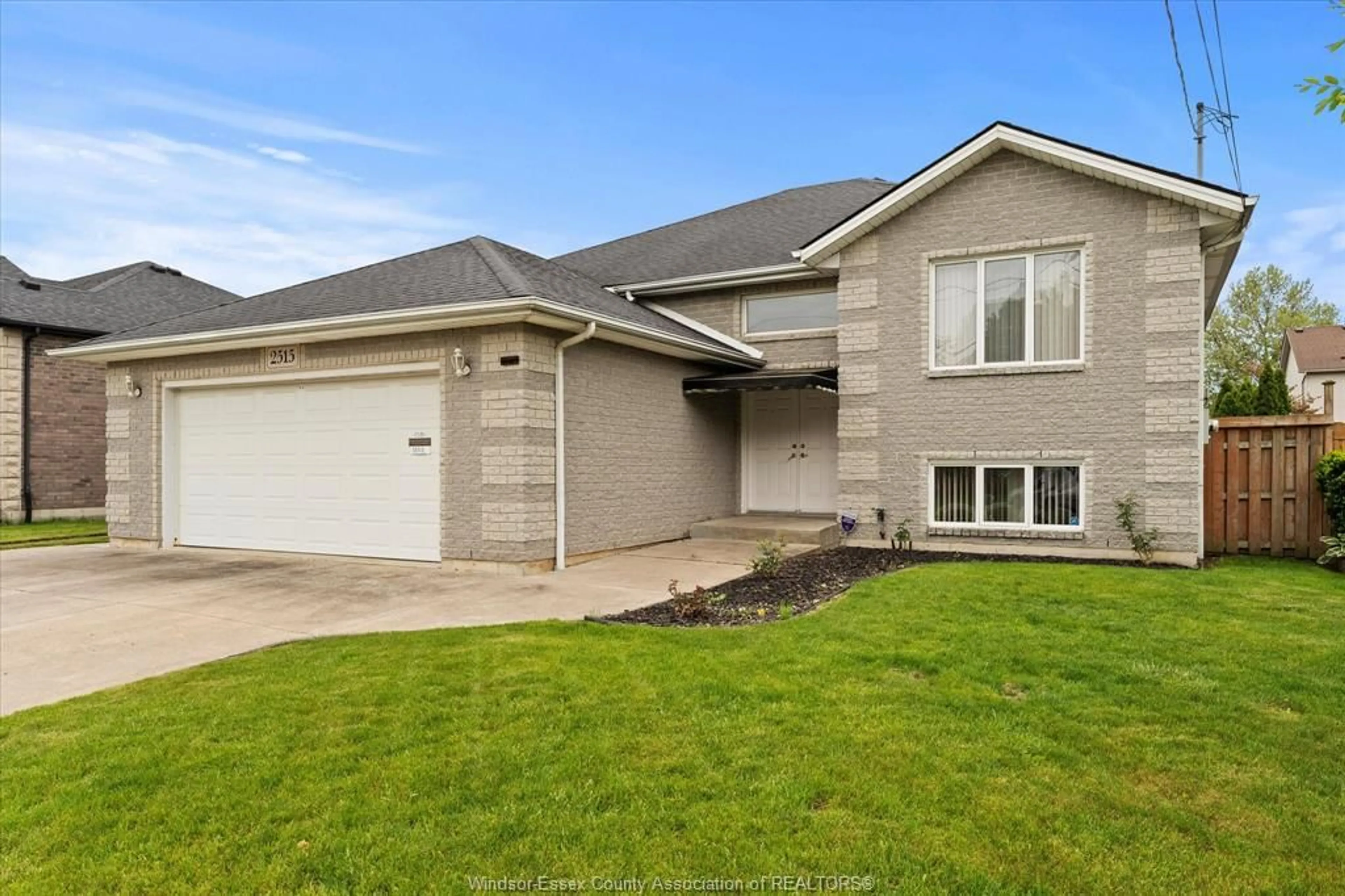Home with vinyl exterior material, street for 2515 COUSINEAU St, LaSalle Ontario N9H 2M2