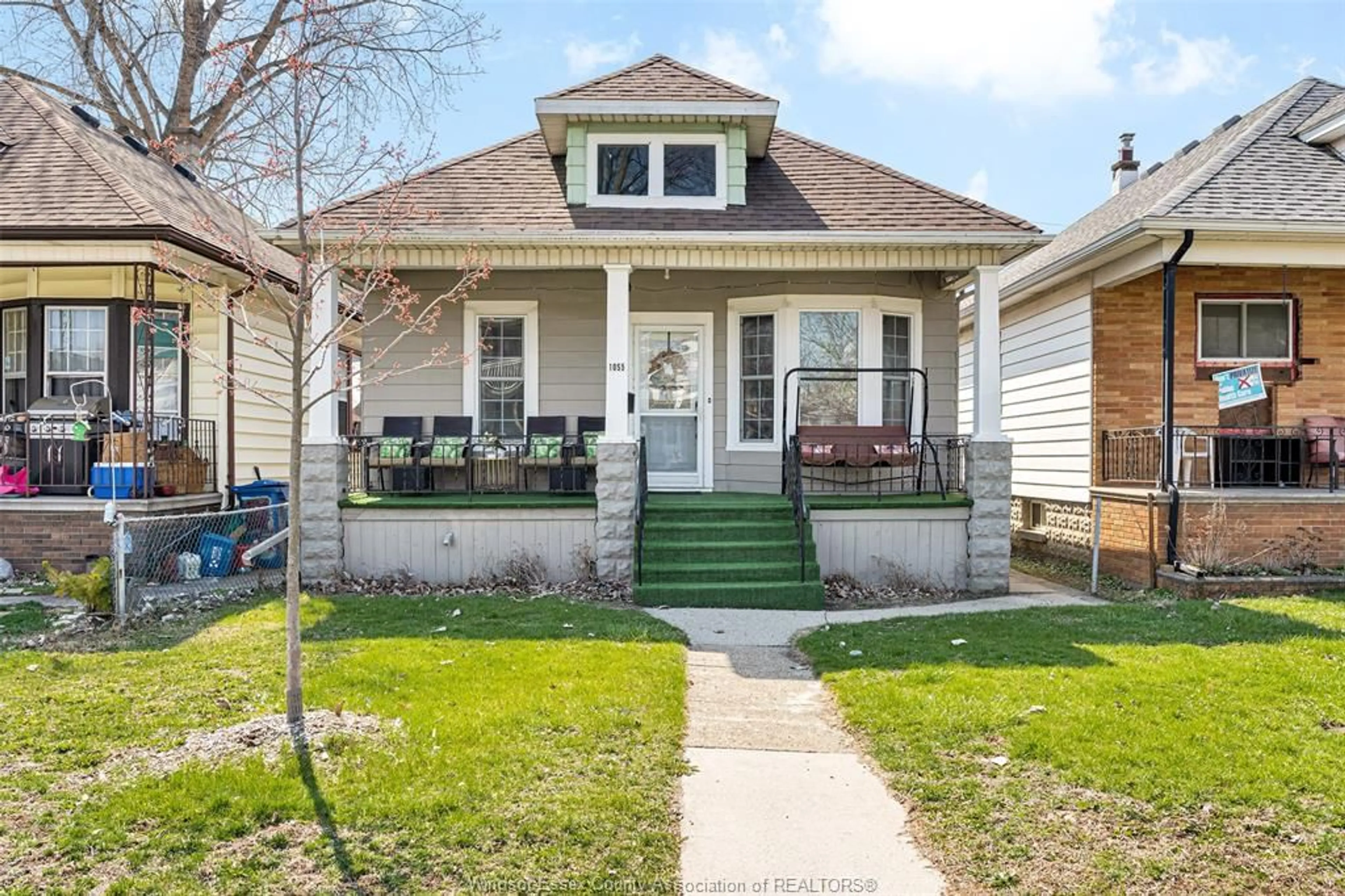 Home with vinyl exterior material, street for 1055 HALL, Windsor Ontario N9A 2M6