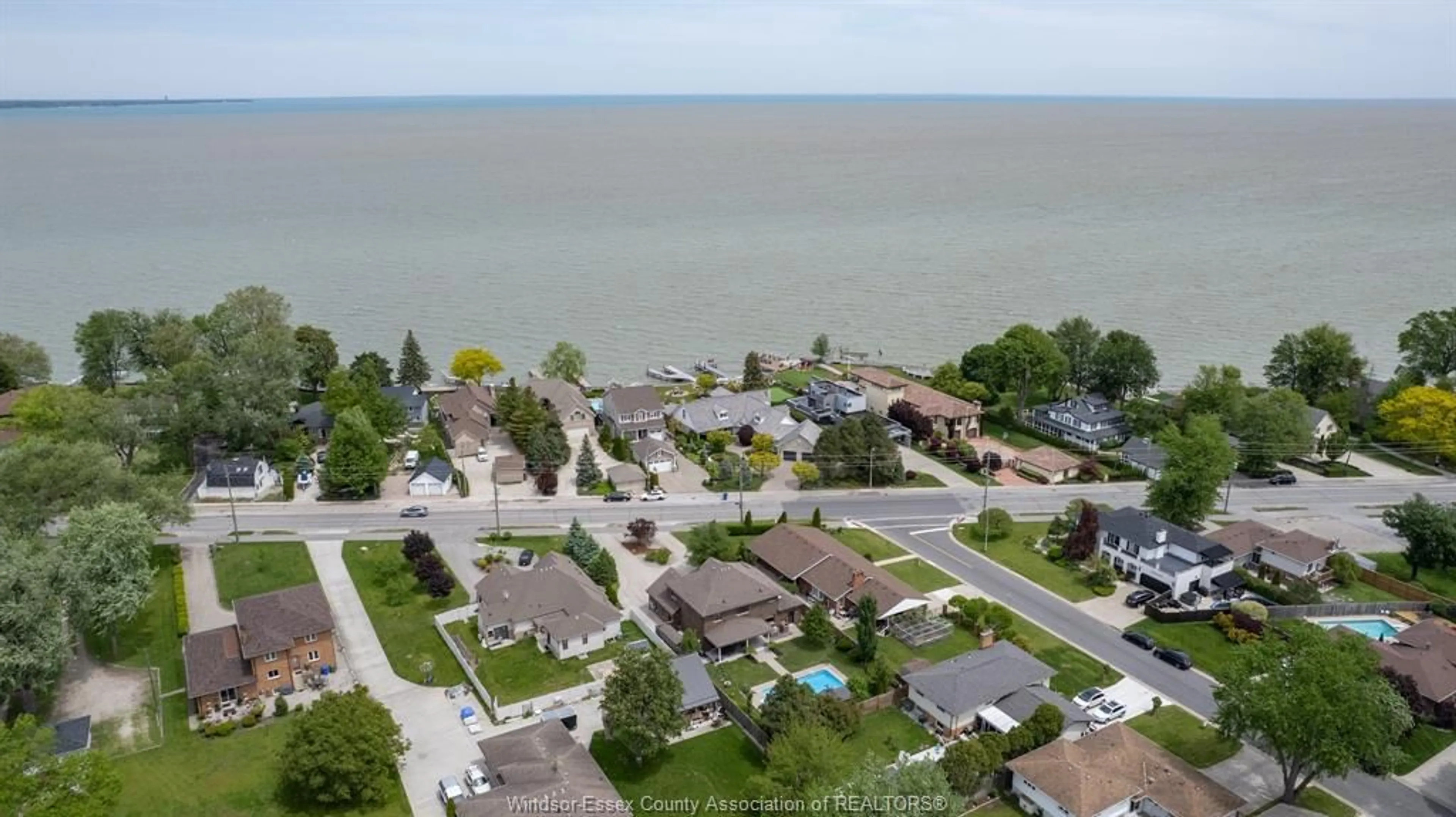 A pic from outside/outdoor area/front of a property/back of a property/a pic from drone, water/lake/river/ocean view for 13013 RIVERSIDE Dr, Tecumseh Ontario N8N 2L9