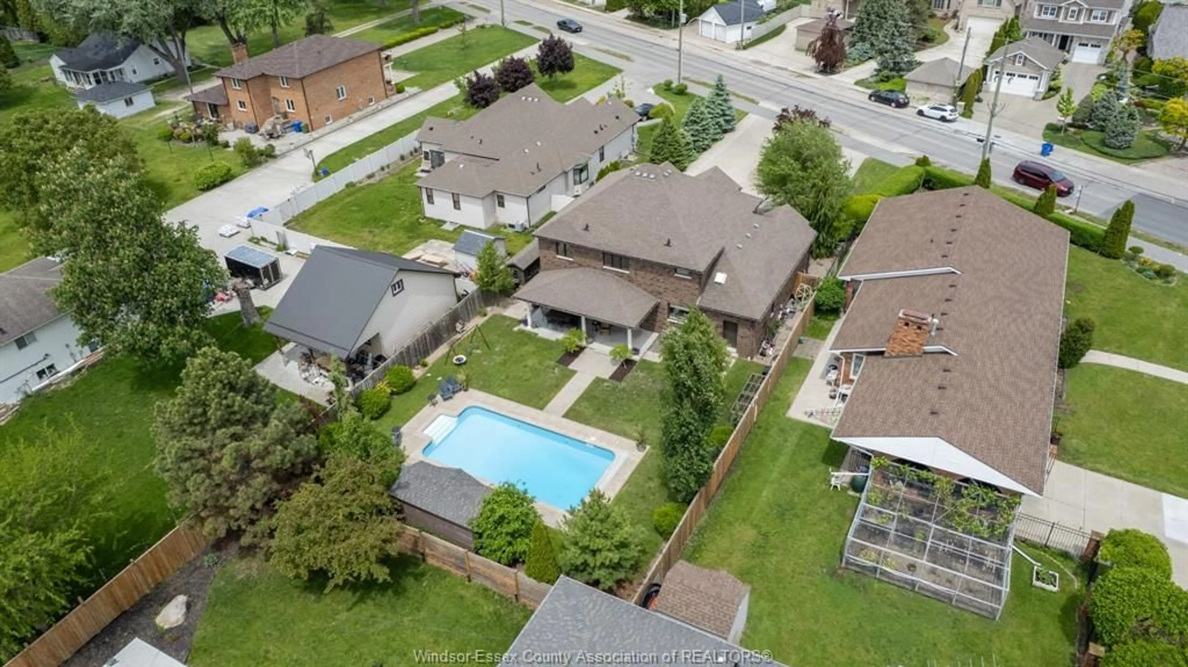 A pic from outside/outdoor area/front of a property/back of a property/a pic from drone, street for 13013 RIVERSIDE Dr, Tecumseh Ontario N8N 2L9