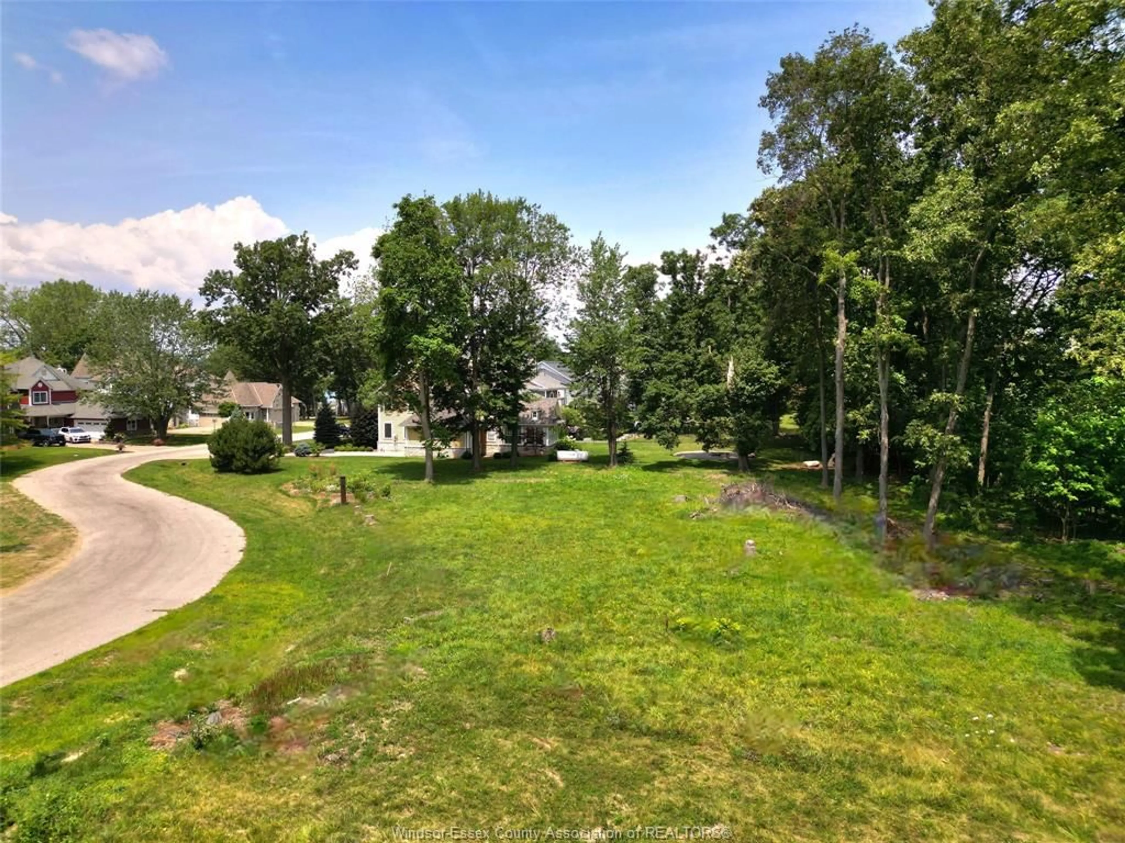 A pic from outside/outdoor area/front of a property/back of a property/a pic from drone, forest/trees view for 261 CRYSTAL BAY, Amherstburg Ontario N9V 4A6