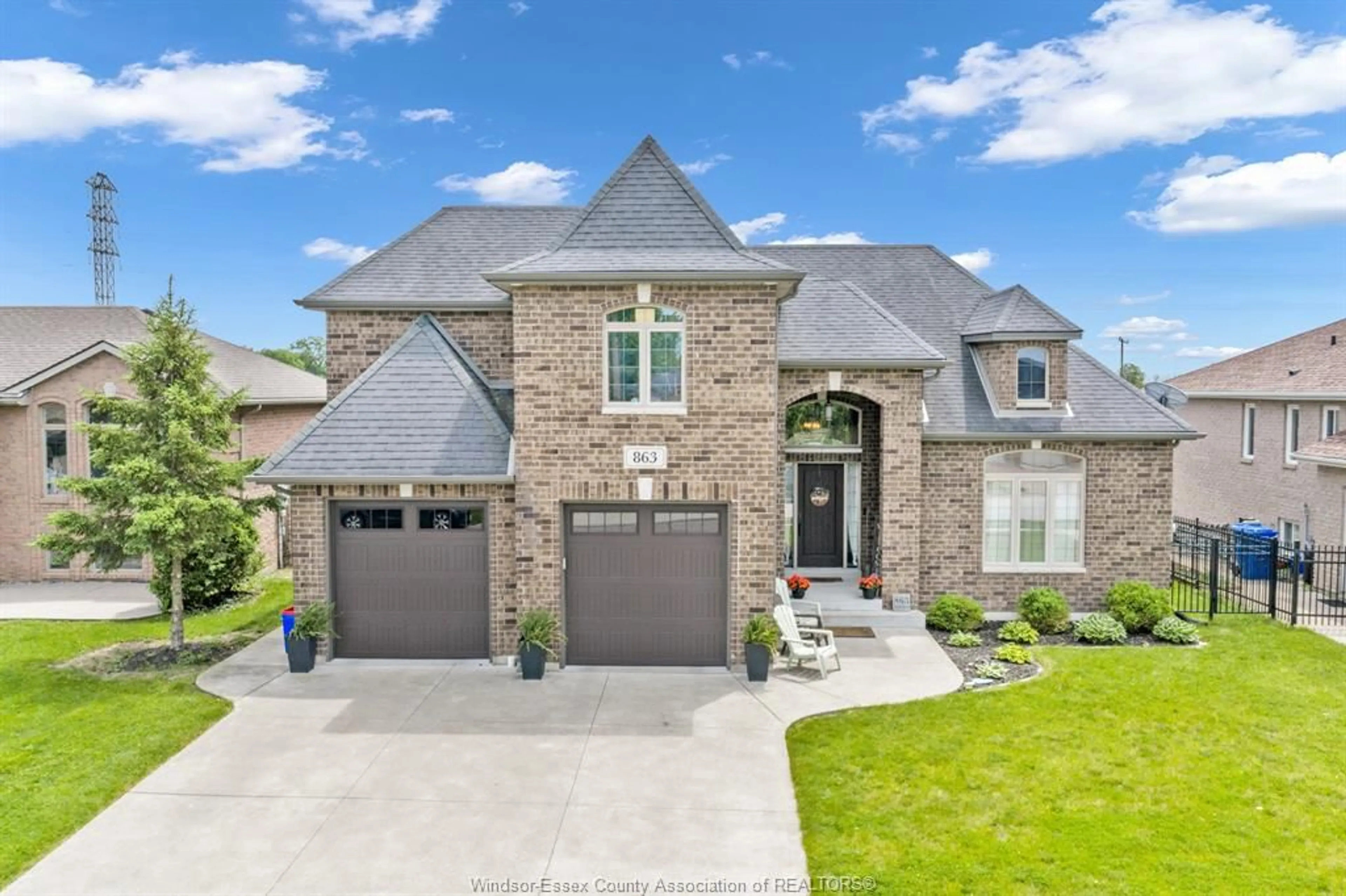 Home with brick exterior material, street for 863 SOUTHWOOD Dr, Lakeshore Ontario N0R 1A0