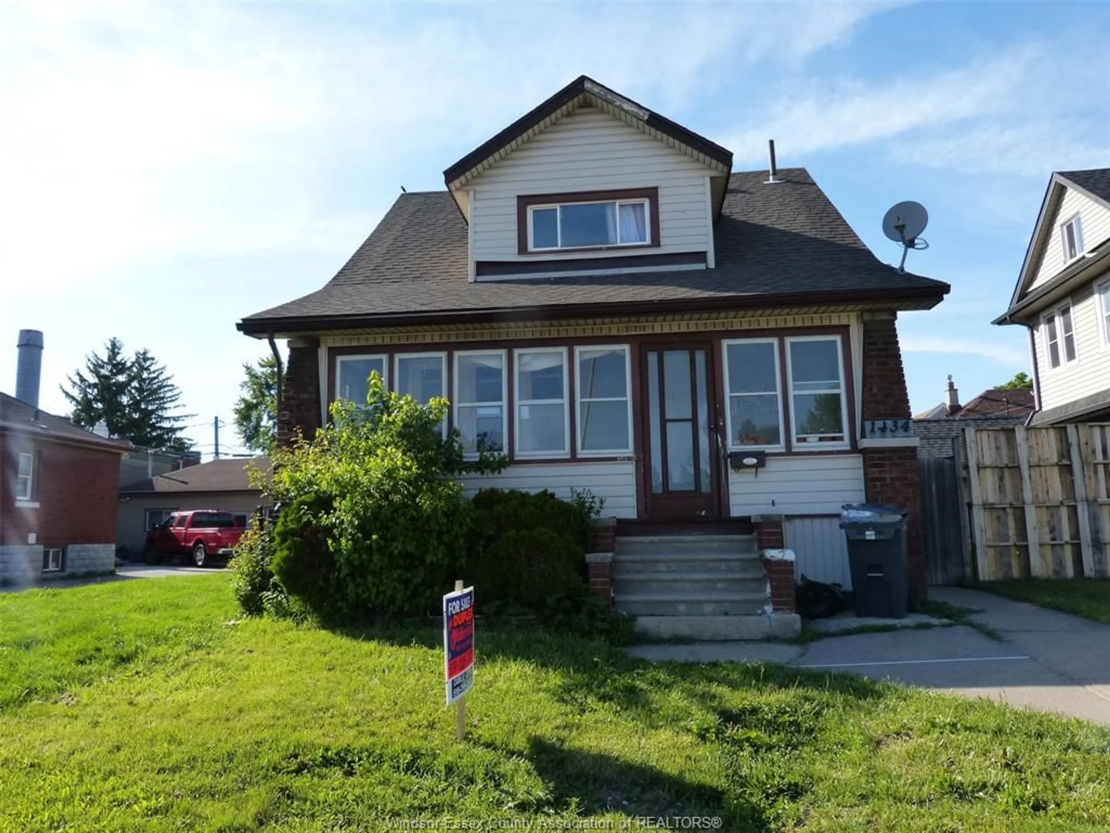 Home with vinyl exterior material, street for 1434 TECUMSEH Blvd, Windsor Ontario N8X 1H5