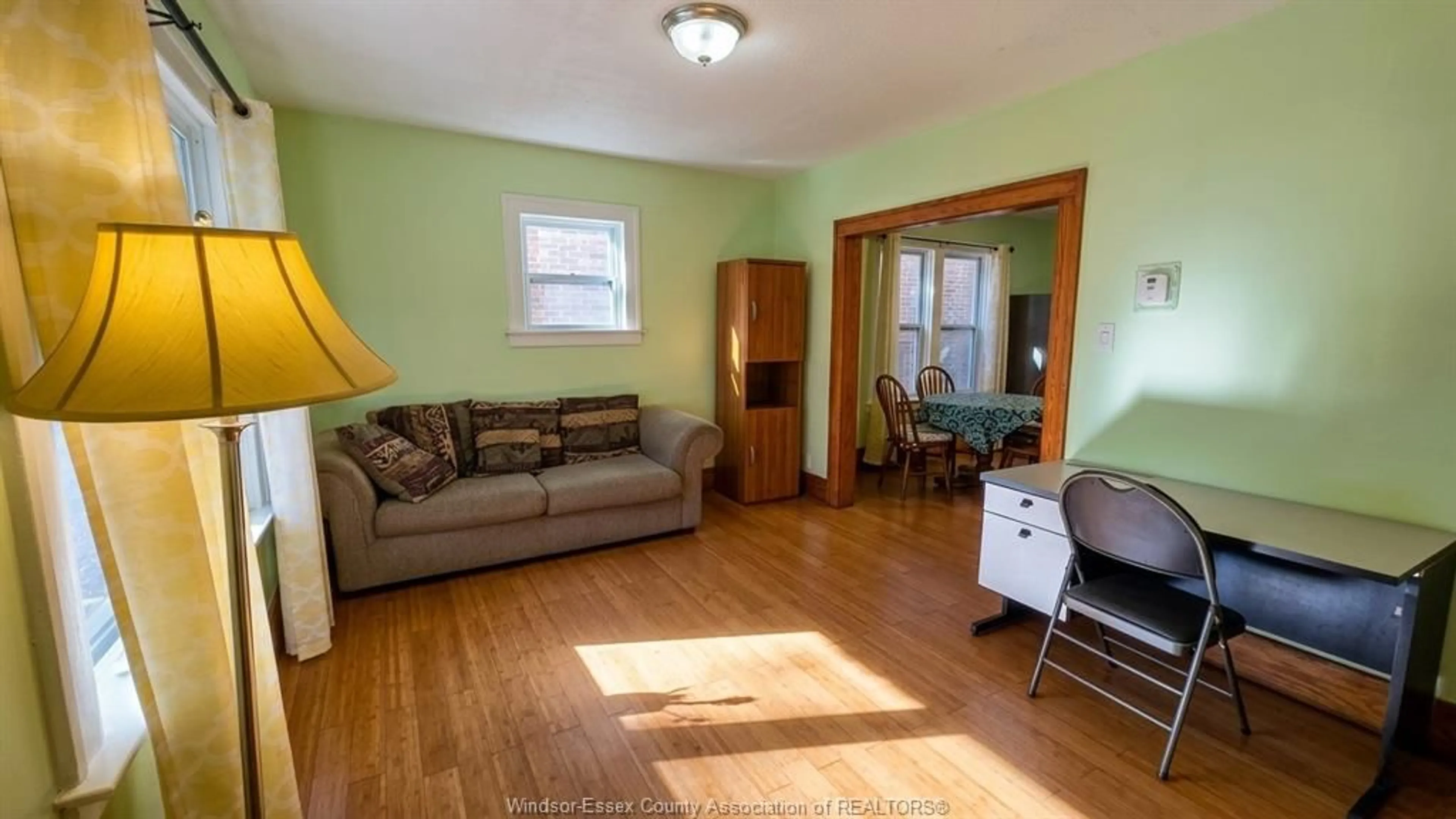 Living room with furniture, wood/laminate floor for 721-723 CAMPBELL AVE Ave, Windsor Ontario N9B 2H6