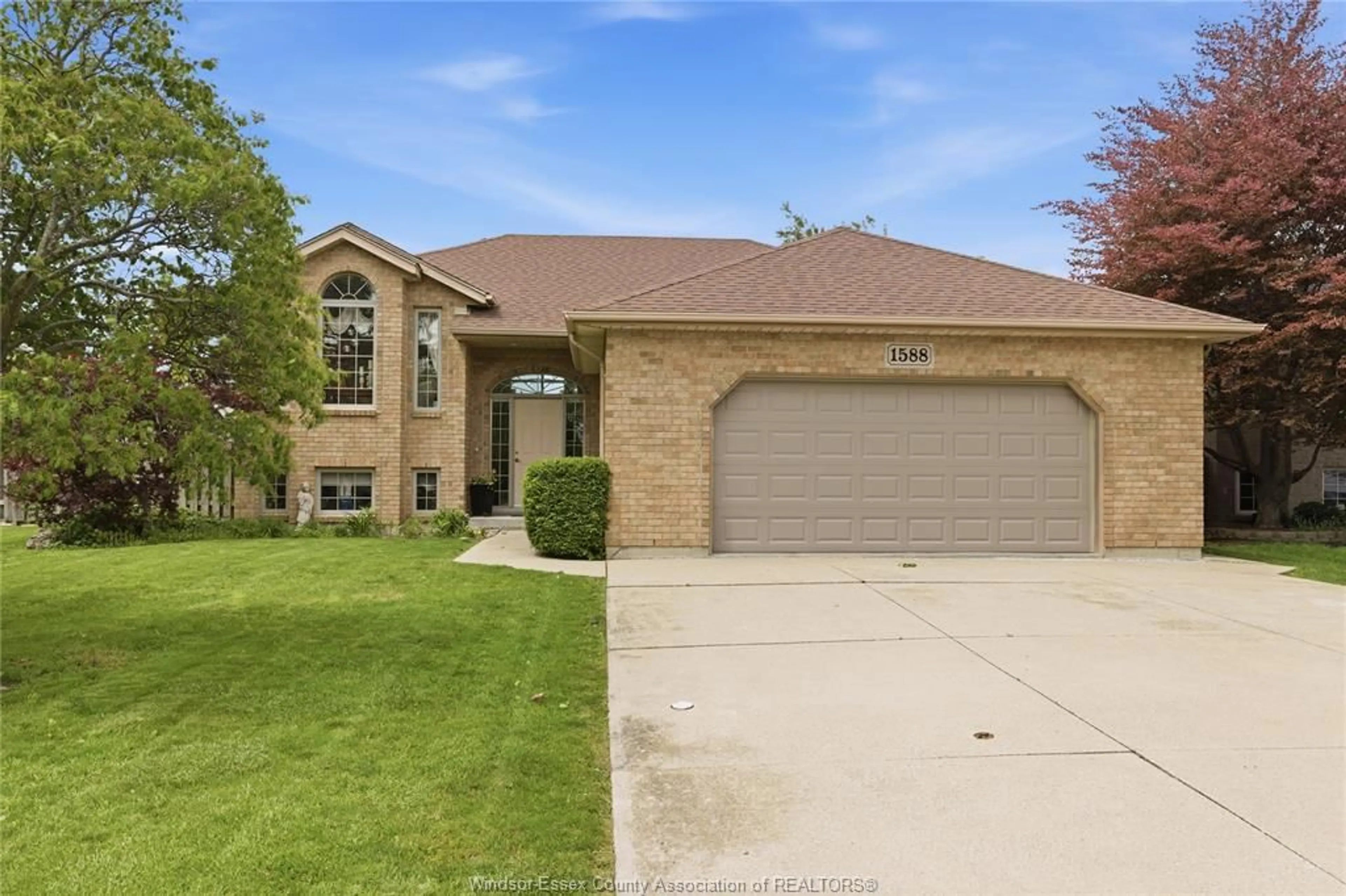 Home with brick exterior material, street for 1588 WHITEWOOD Dr, Lakeshore Ontario N0R 1A0