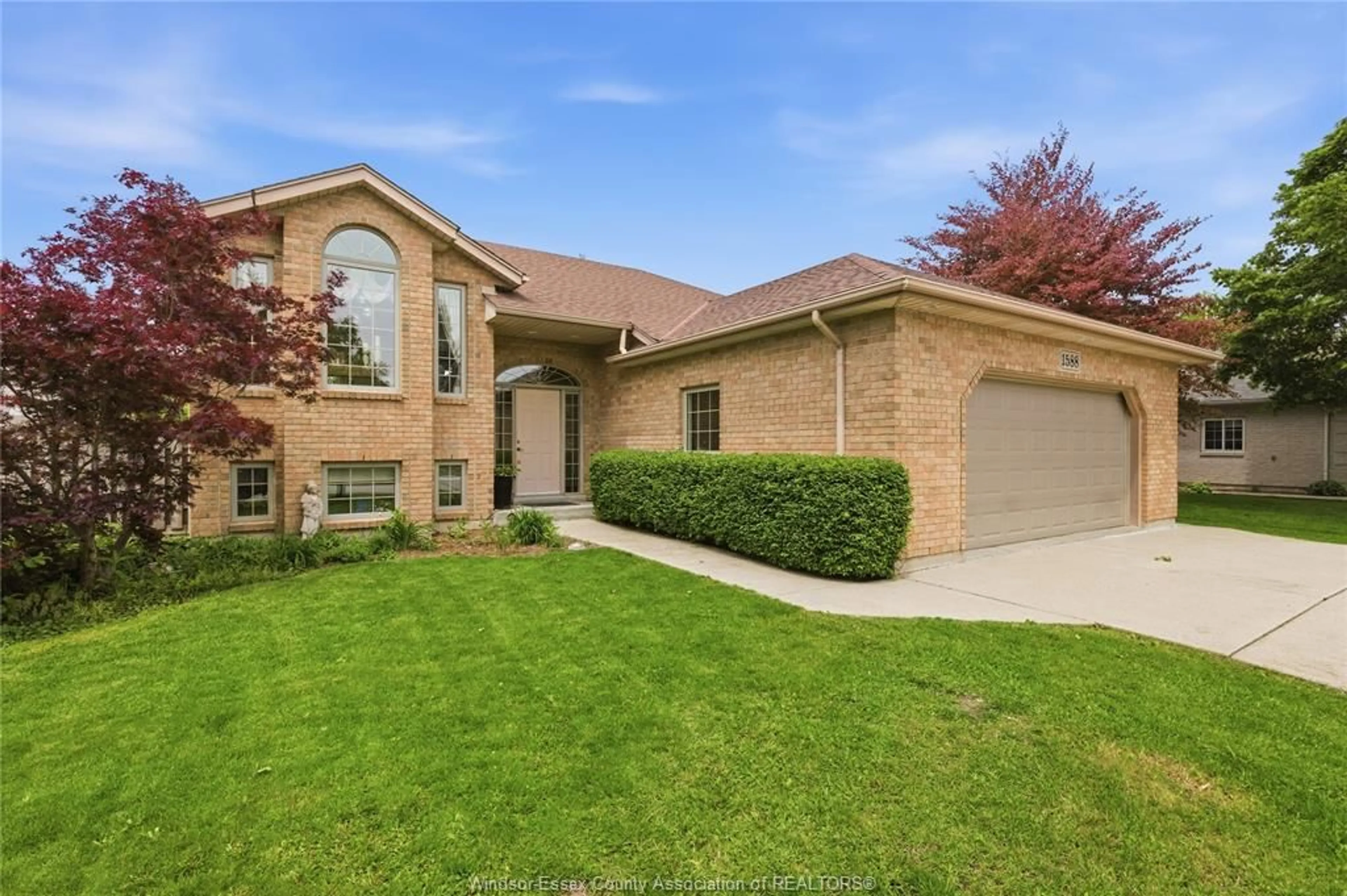 Home with brick exterior material, street for 1588 WHITEWOOD Dr, Lakeshore Ontario N0R 1A0