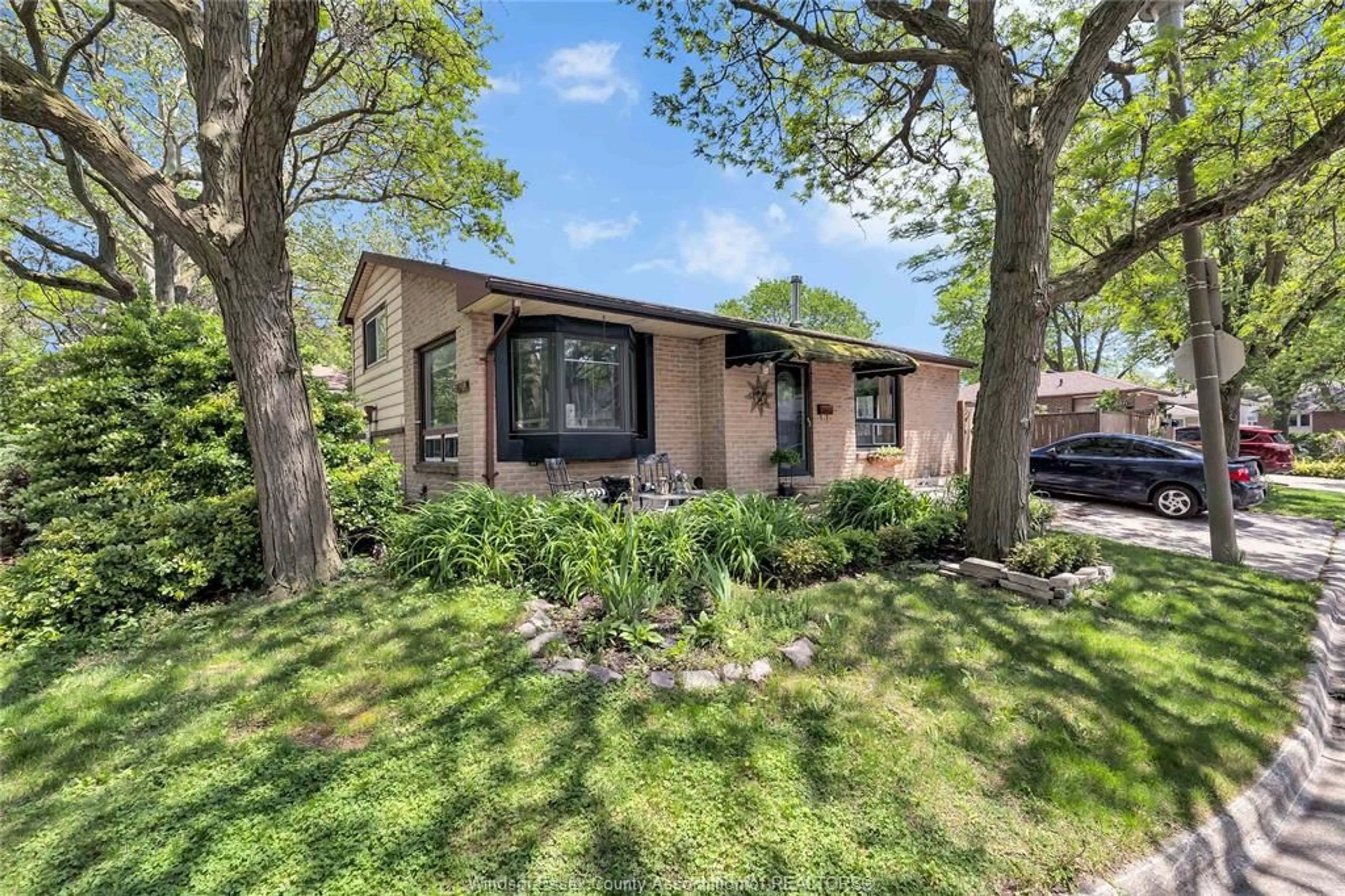 Home with brick exterior material, street for 8315 ENFIELD Pl, Windsor Ontario N8S 4M8