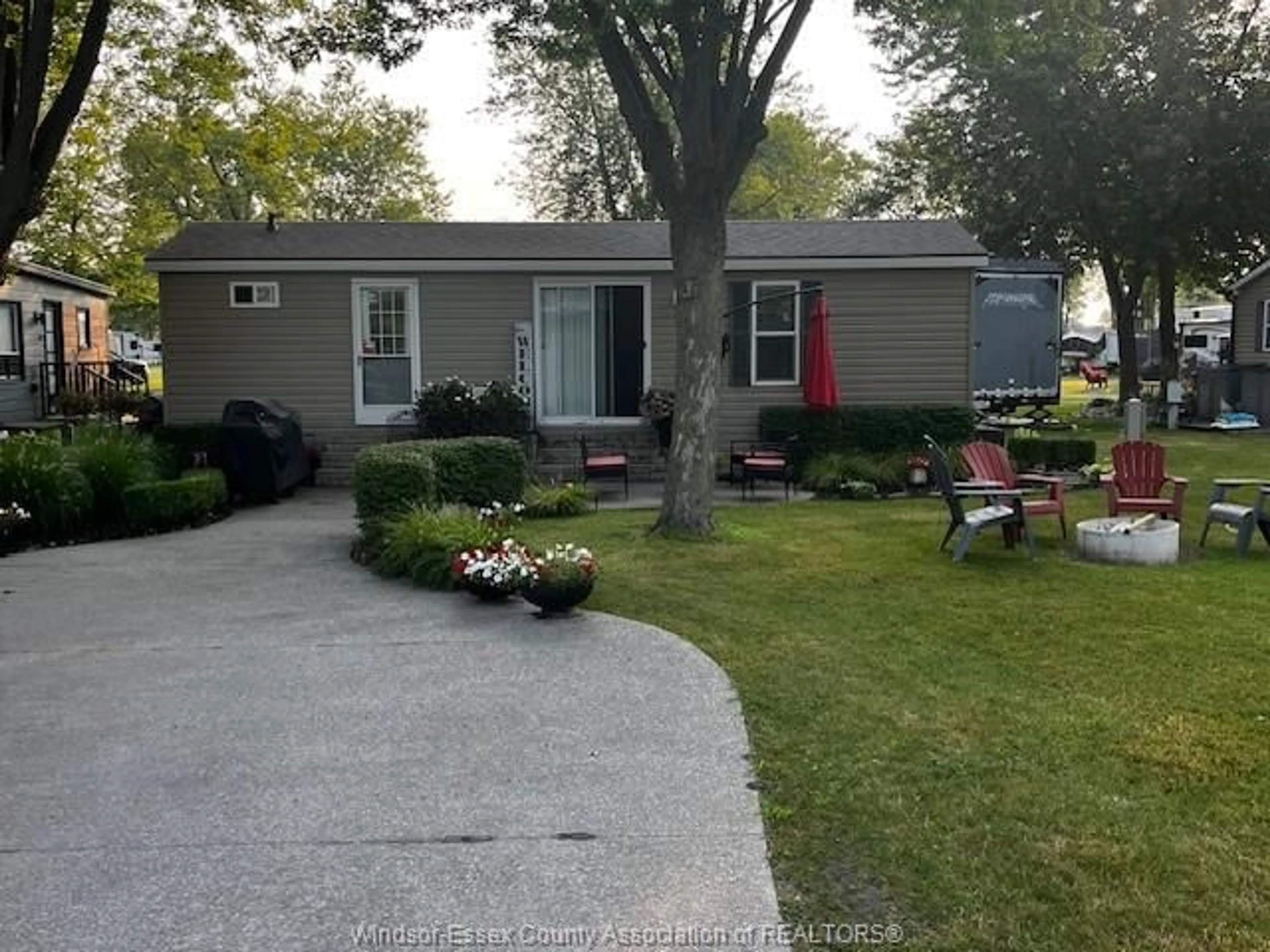Home with vinyl exterior material, street for 981 COUNTY RD 2 #535, Lakeshore Ontario N8L 1B4